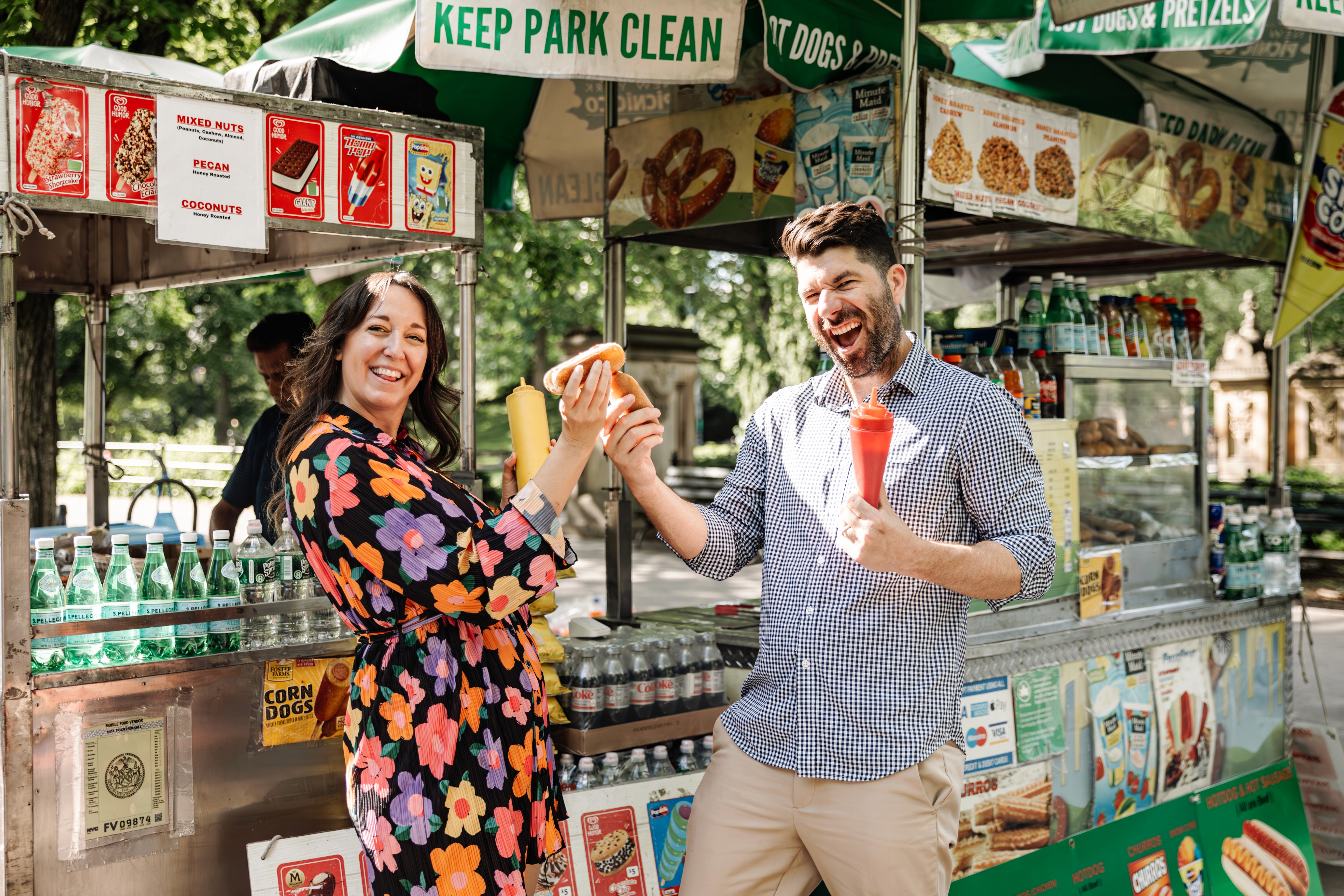 6:13 PMNewly engaged couple sitting on a stoop in the West Village, NYC bathed in warm golden hour light — romantic, candid golden hour engagement photography by Lizz Spano Photography, New York City engagement photographer.