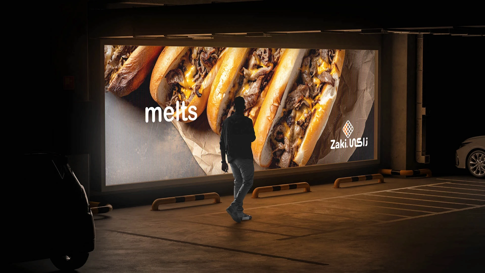 Streetside billboard with flyposters of the Batch.Works brand and illustrations