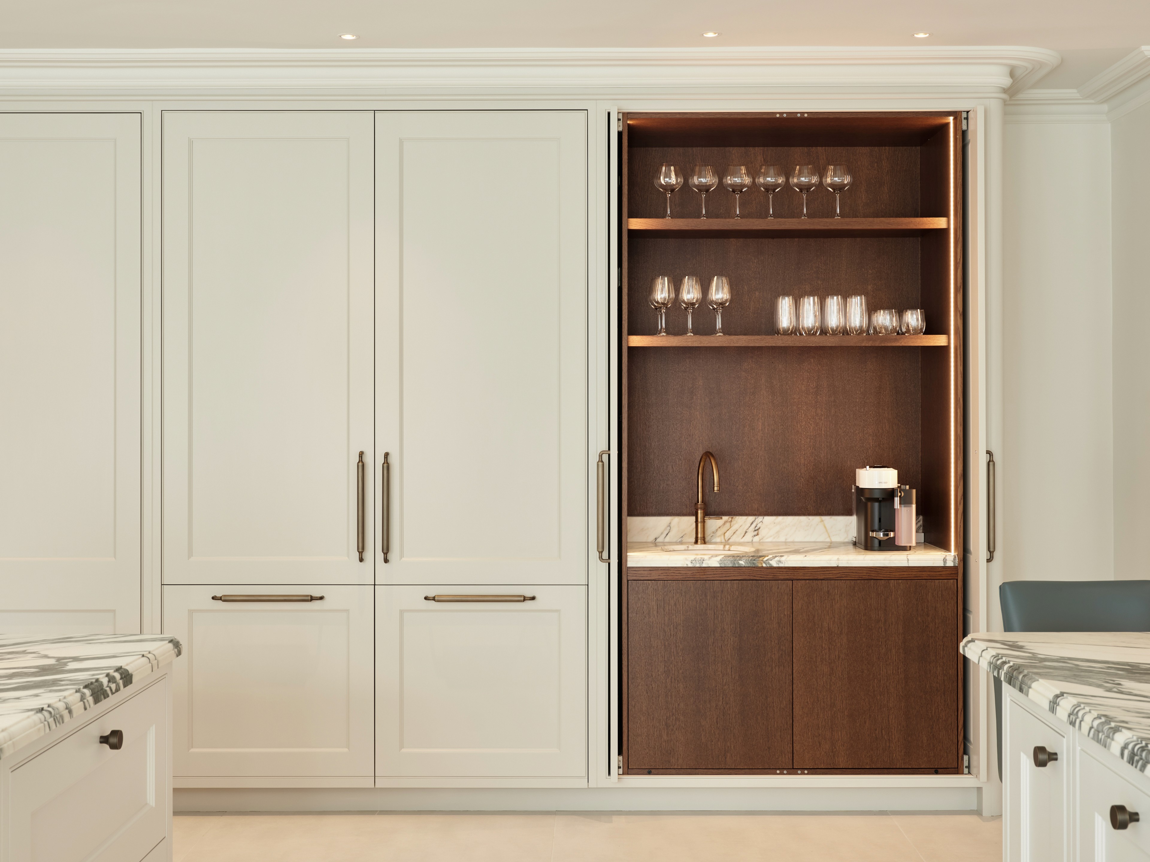 Provence style shaker kitchen pantry that conceals appliances, sink and storage