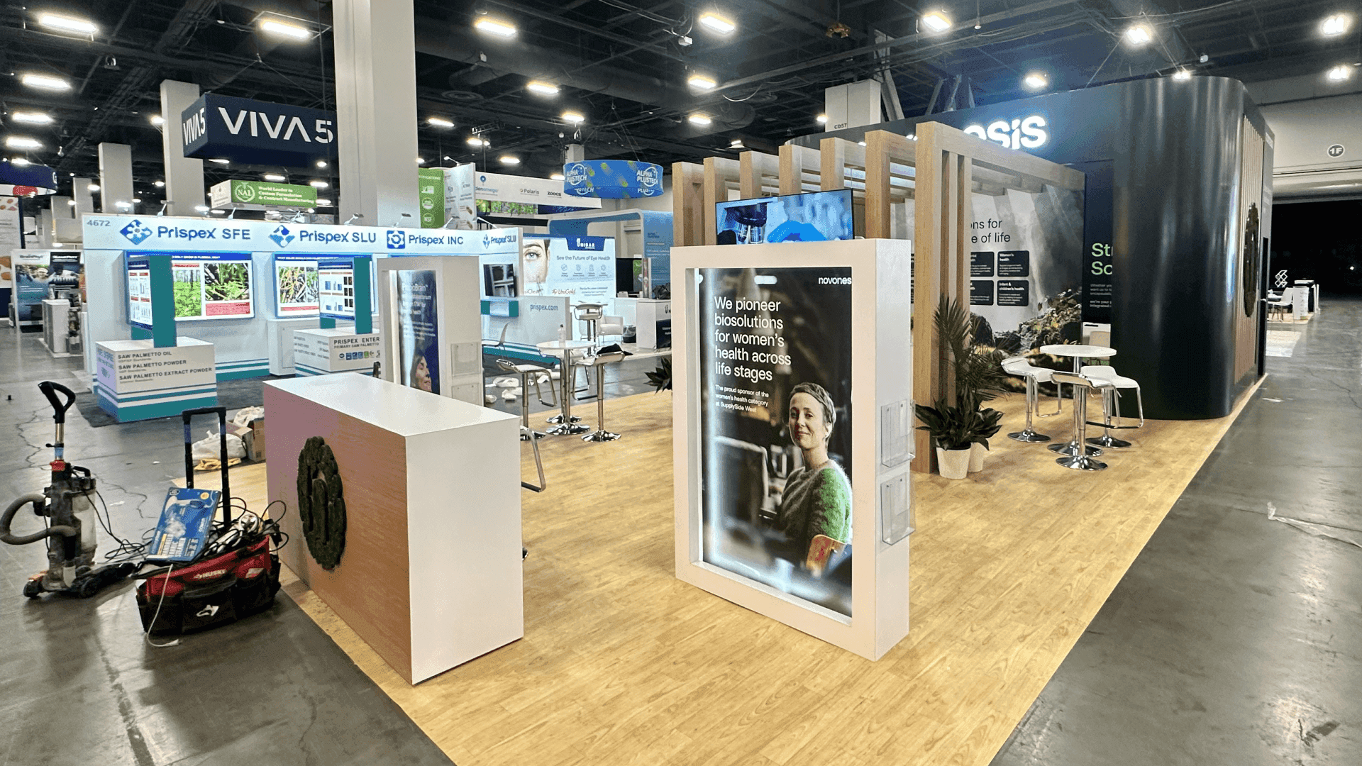 SupplySide West product display booth reference with sample counters, branded graphics, buyer meeting areas, and visitor flow for Mandalay Bay Convention Center exhibitors