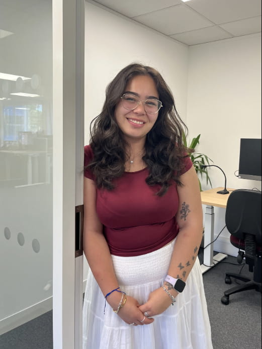 Sales Intern Mya outside of the demo office