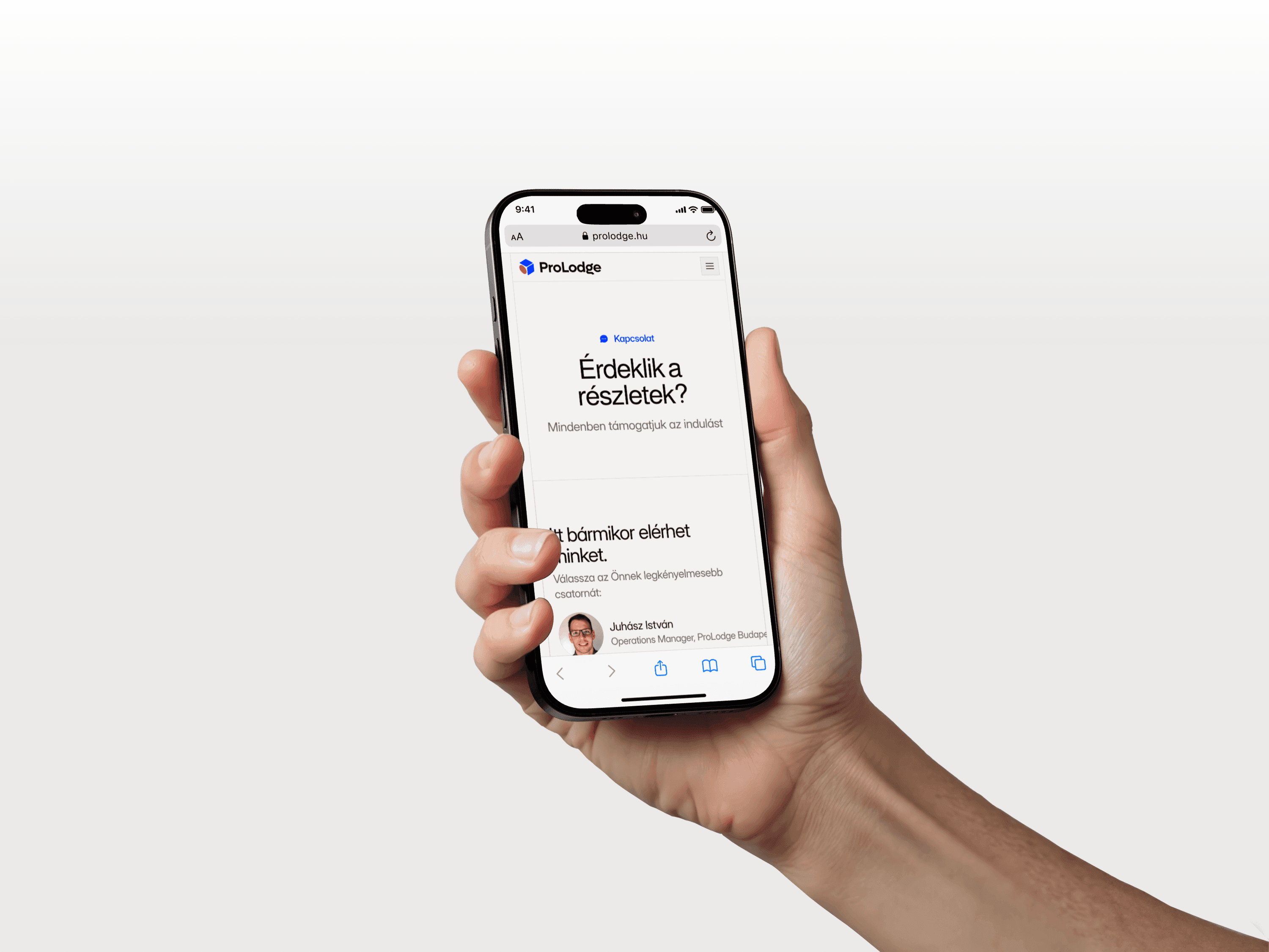 man in white top holding iPhone