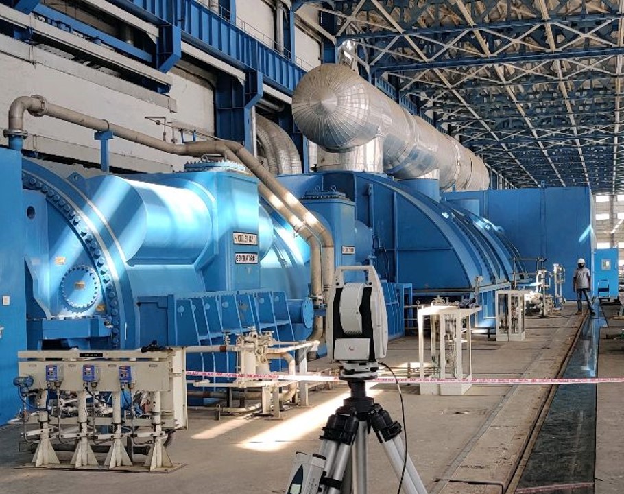 smoke billows from the cooling towers of a power plant
