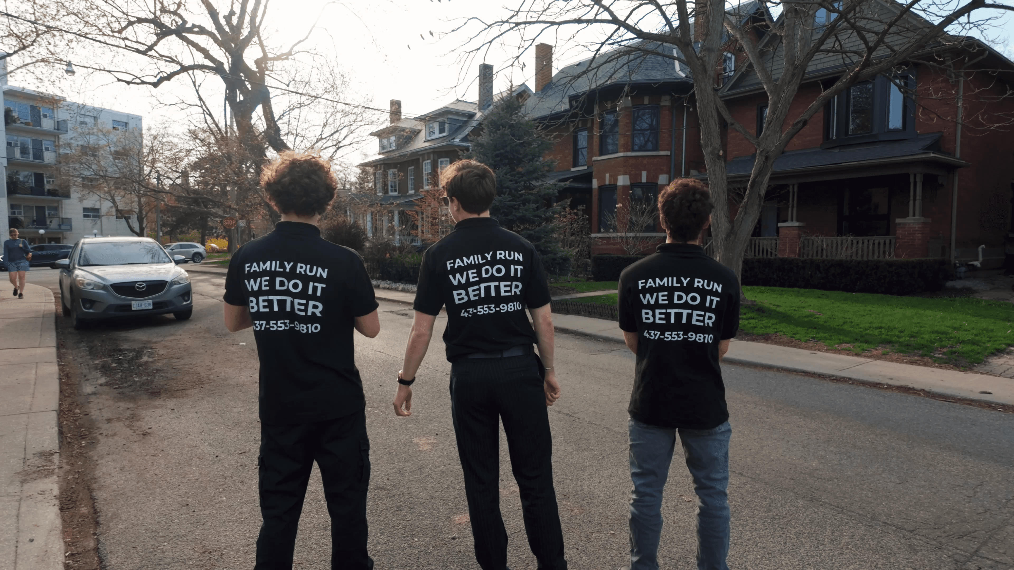 Thirlwell crew wearing Family Run We Do It Better t-shirts on a Toronto street