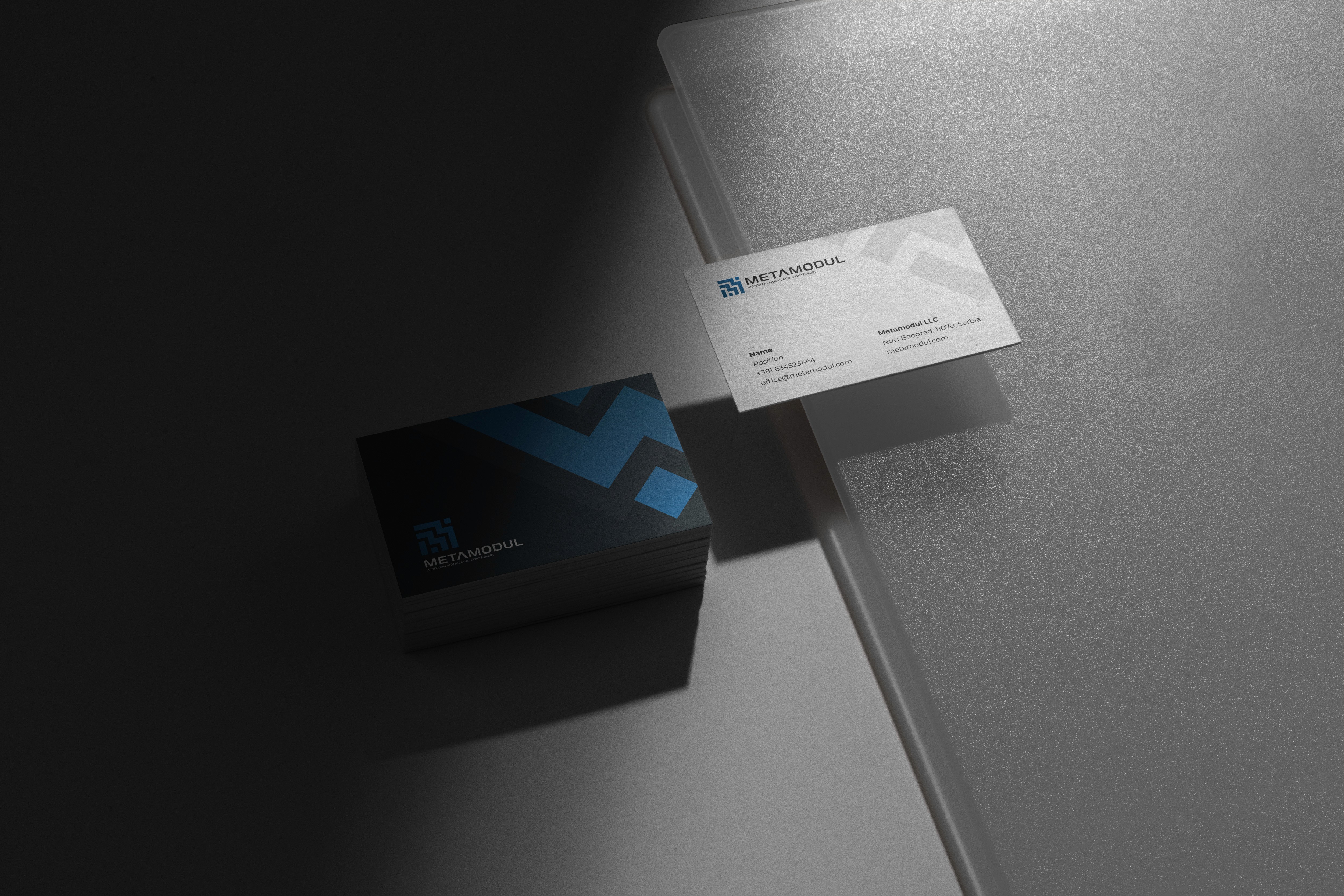 Floating Business Cards With A Construction Company Logo On It