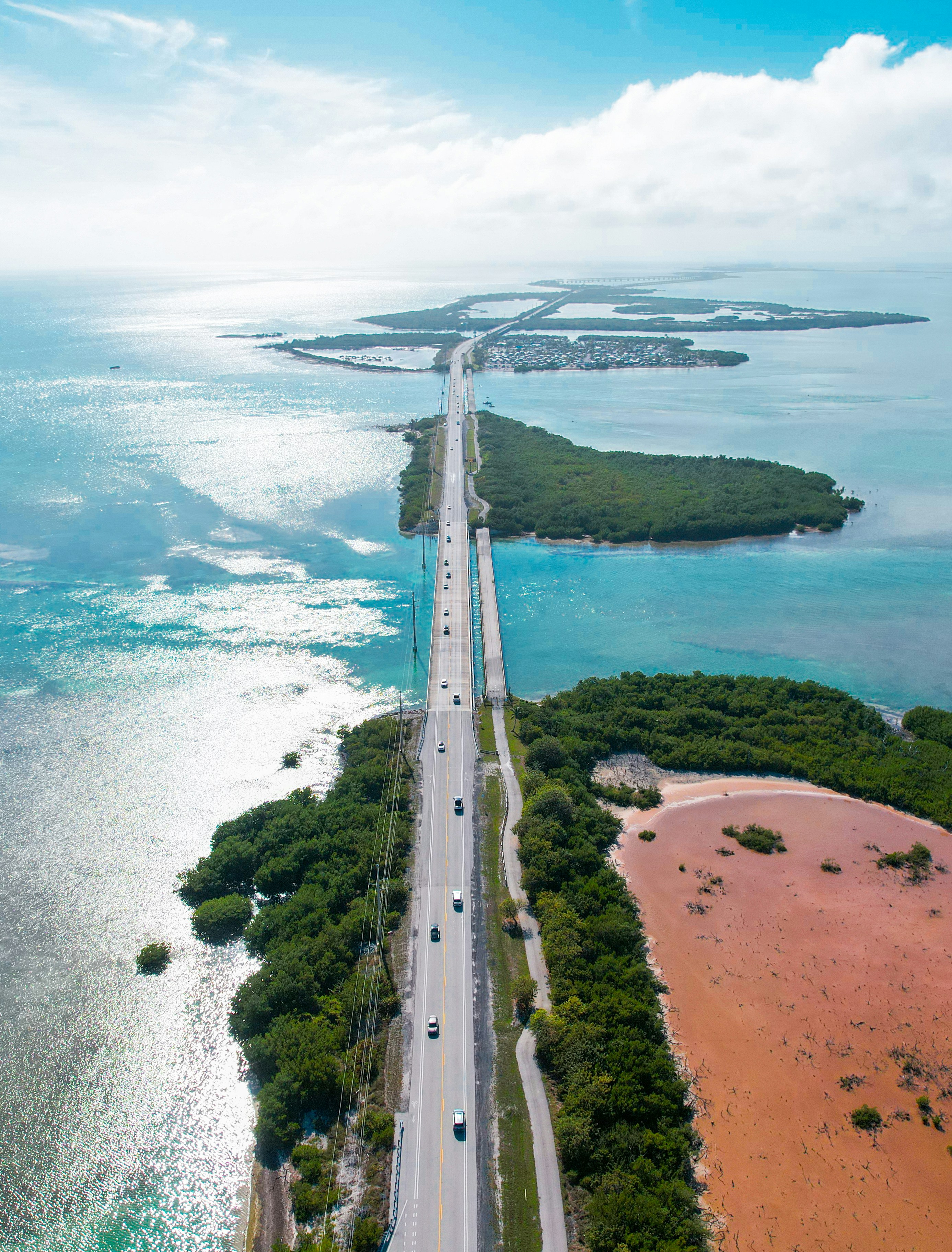 An aerial view of a highway near the ocean