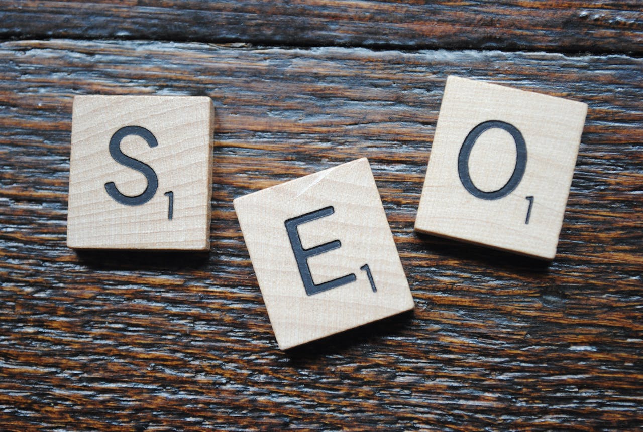 Image of square tiles each with one letter spelling out SEO