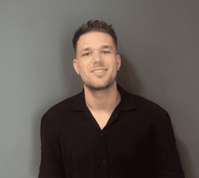 A portrait of a young man smiling