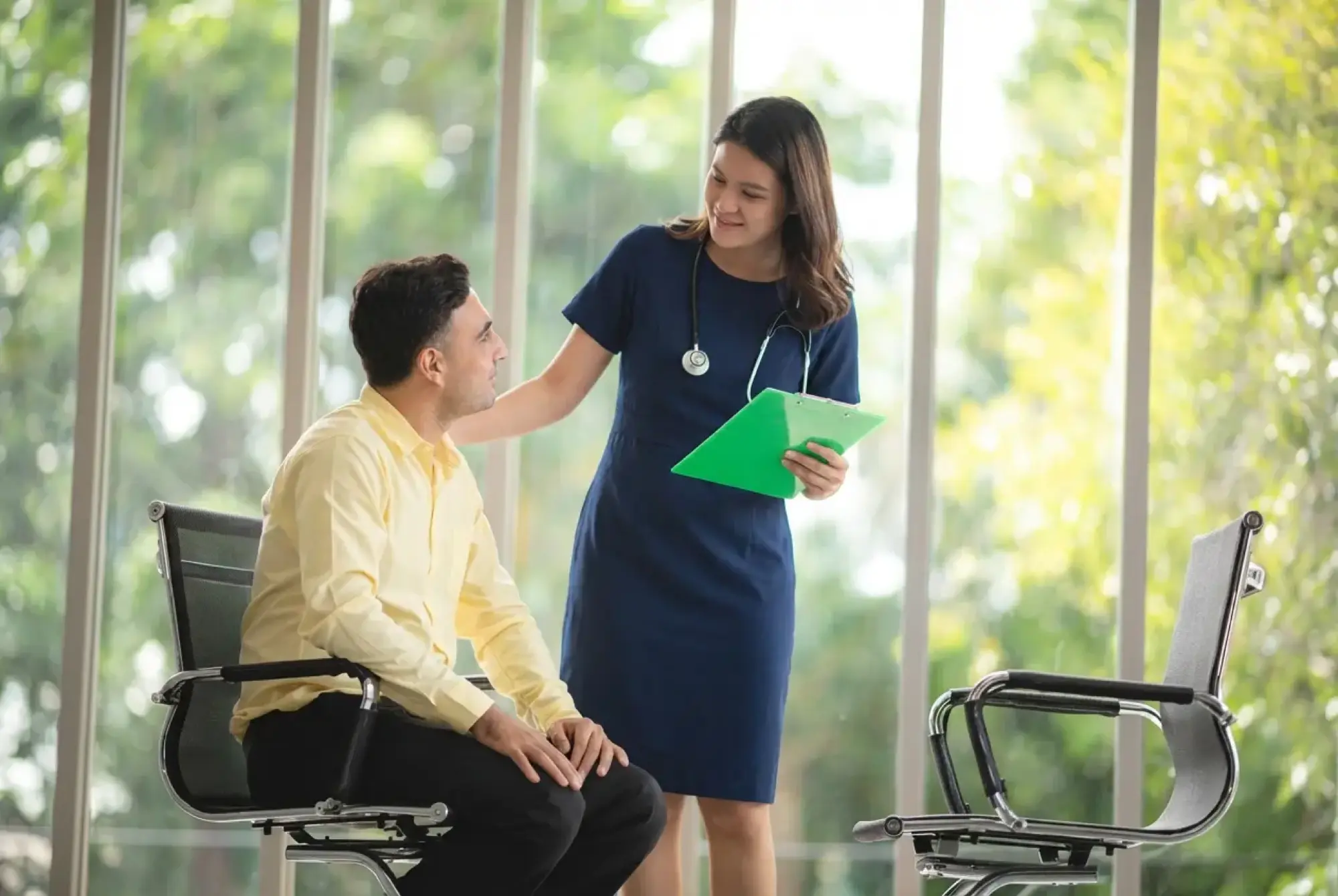 woman wearing gray long-sleeved shirt facing the sea