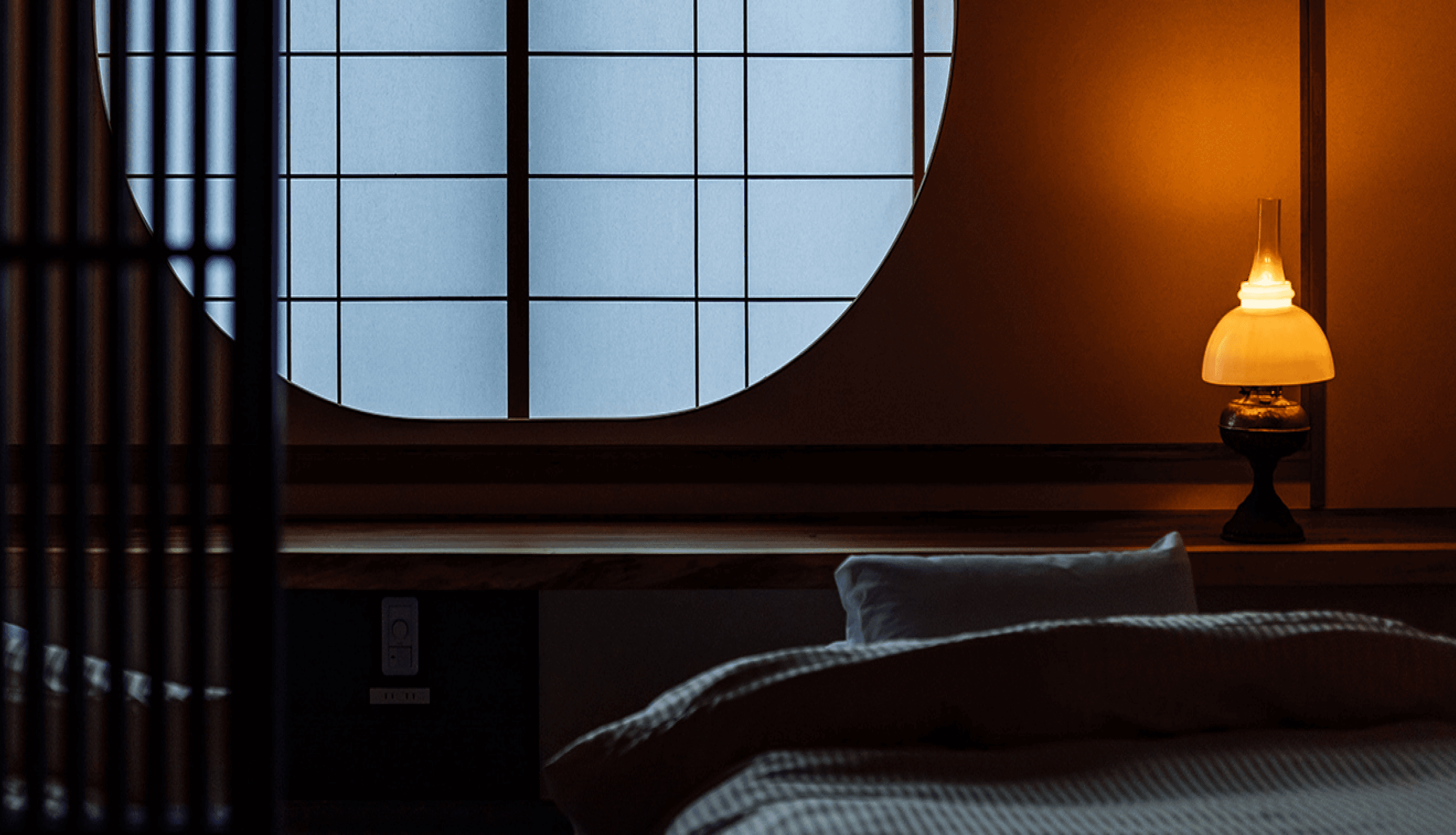 A round window with a bed