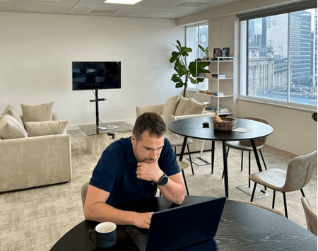 Matt on his computer in an office