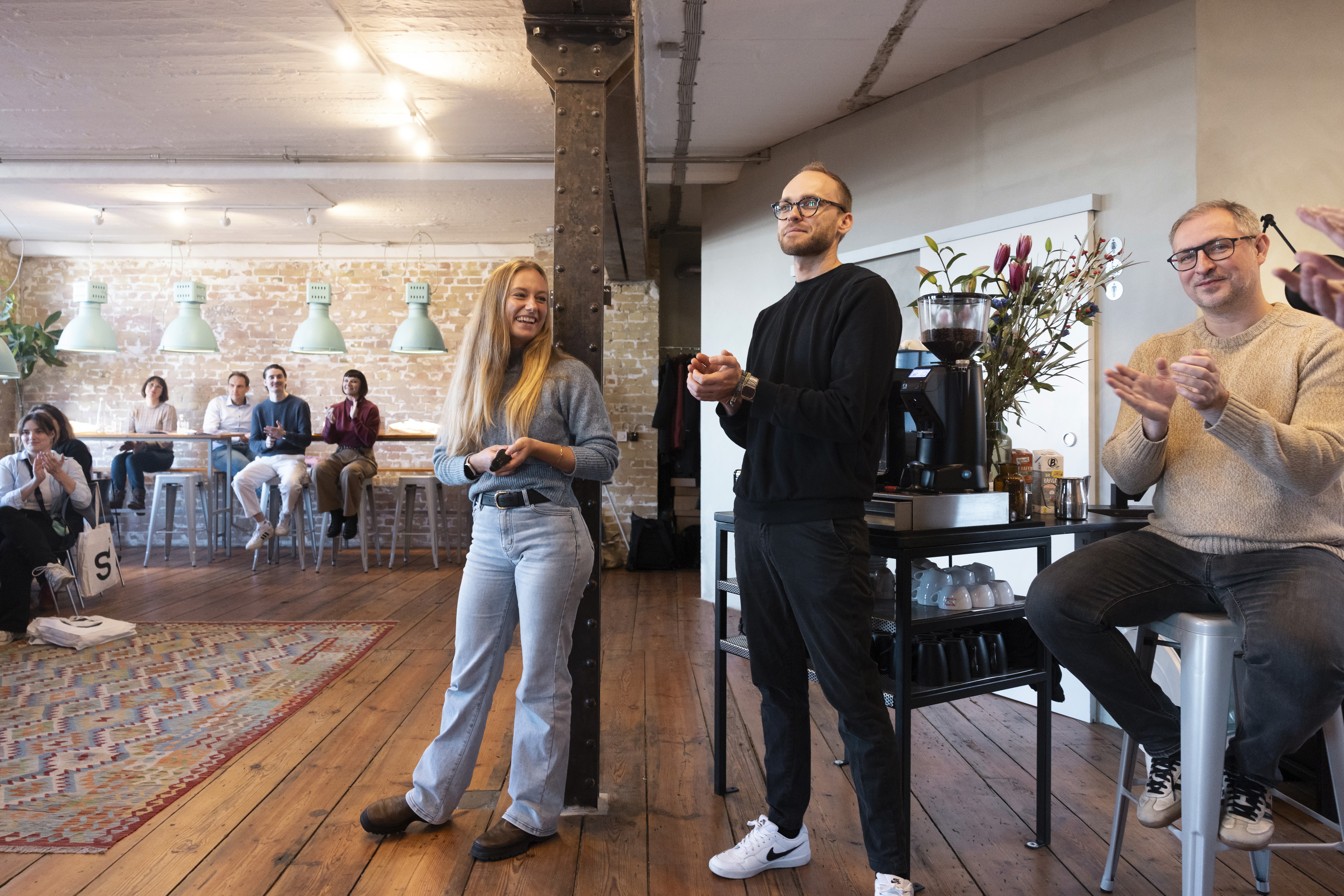 man in blue dress shirt and woman in black long sleeve shirt