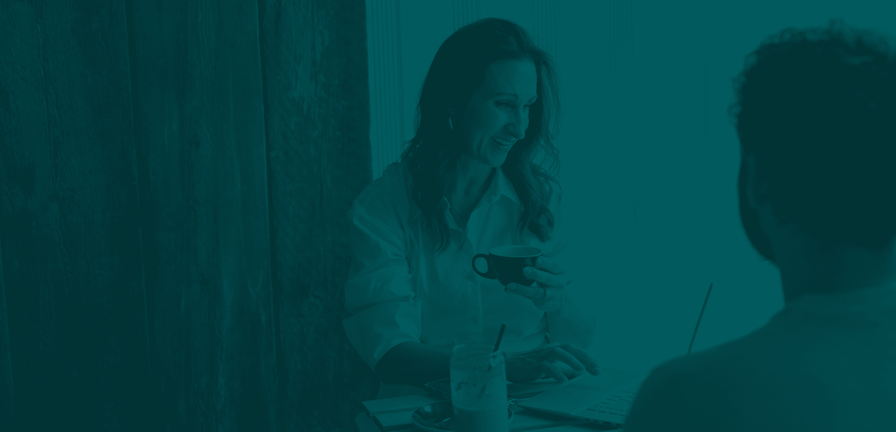 Stacy is speaking to a person, both engaged in conversation.