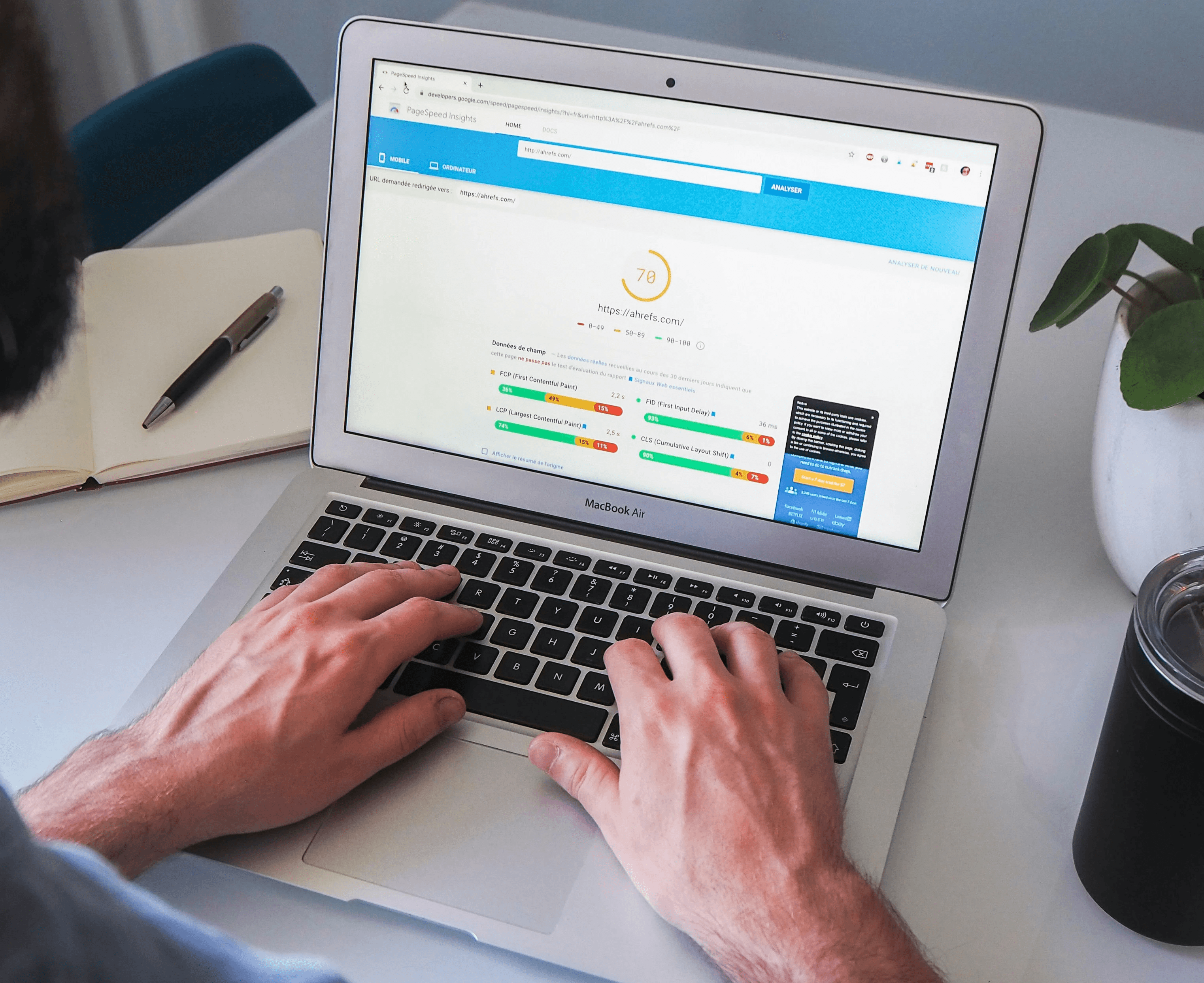Man looking at Google PageSpeed Insights results on a laptop, reviewing website performance and speed metrics