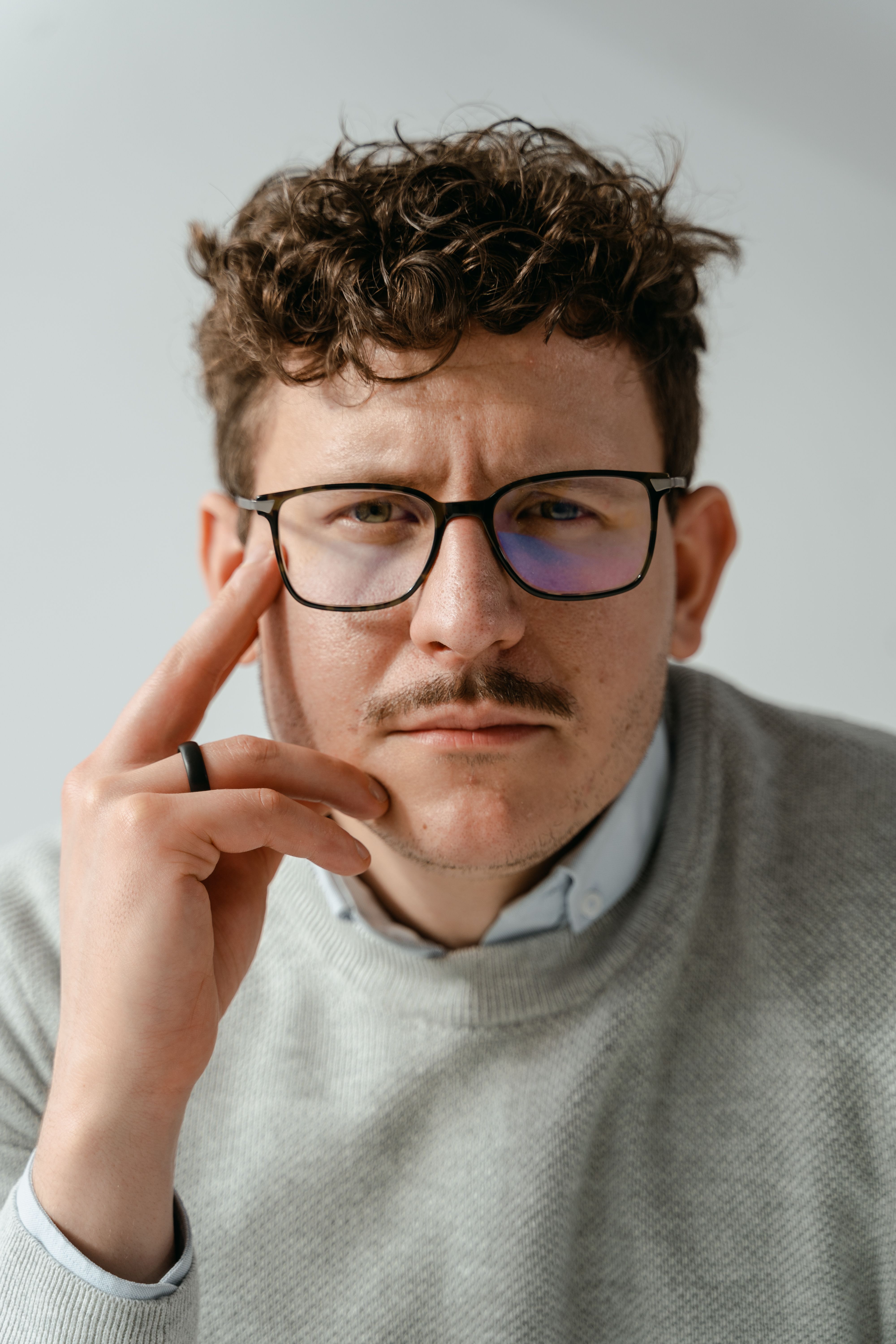 A man wearing specs with a cool and casual look