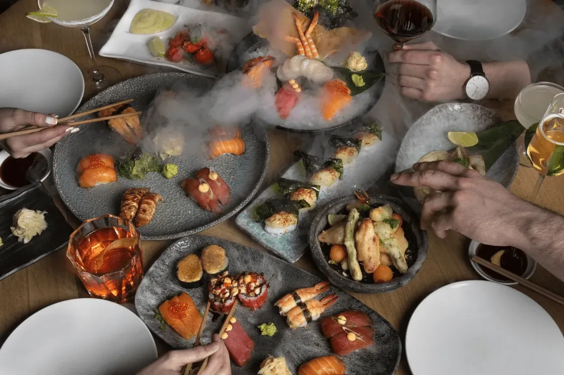 Shared plates of seasonal food on a restaurant table