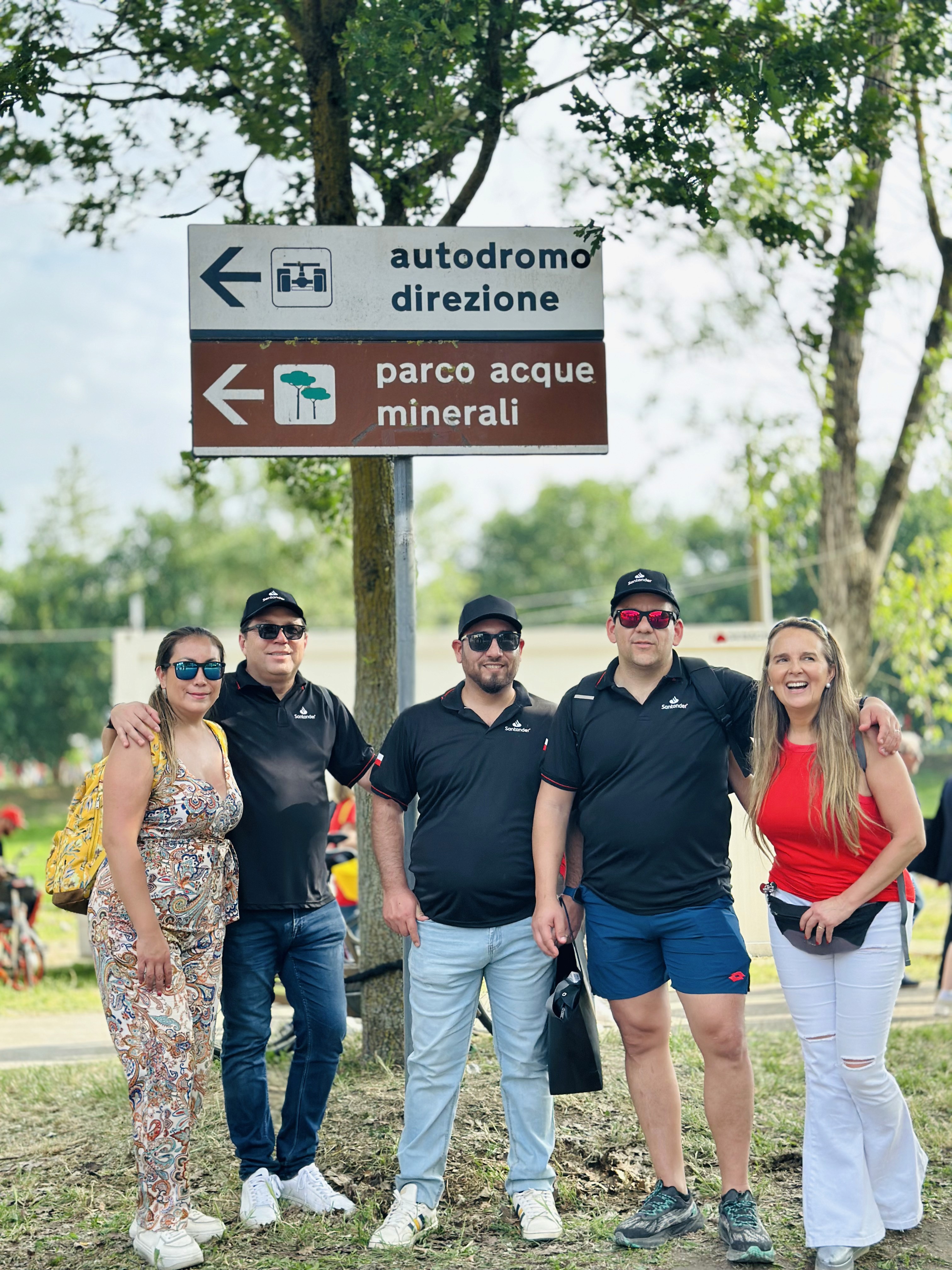 a desk with a computer and speakers on it