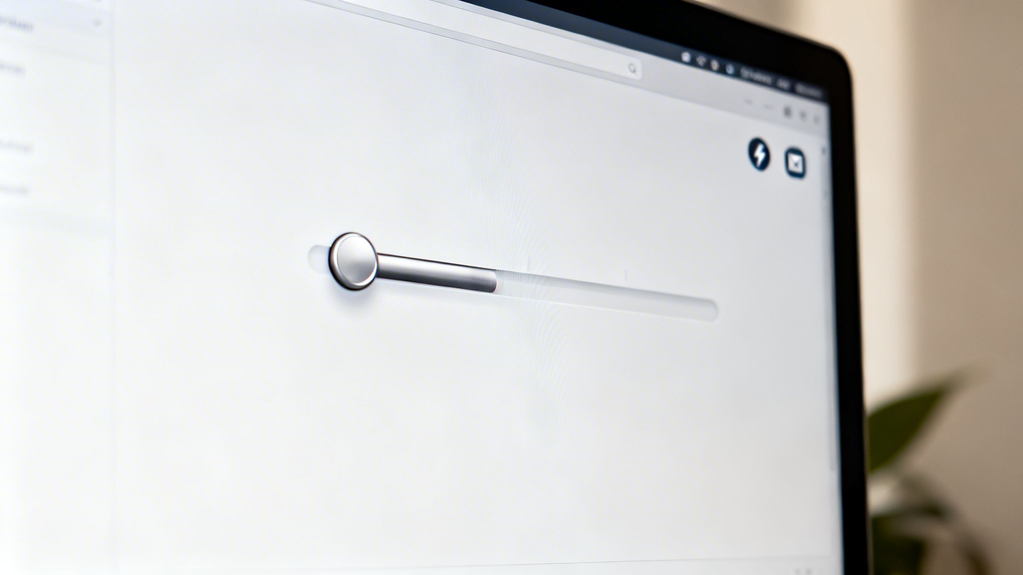 A modern computer screen displays a sleek metallic slider or progress bar on a minimalist white interface.