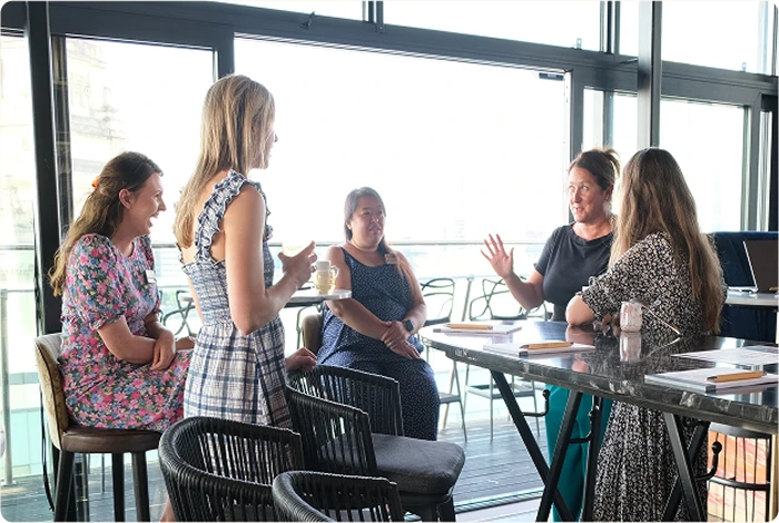 People talking at a Breakfast Club event