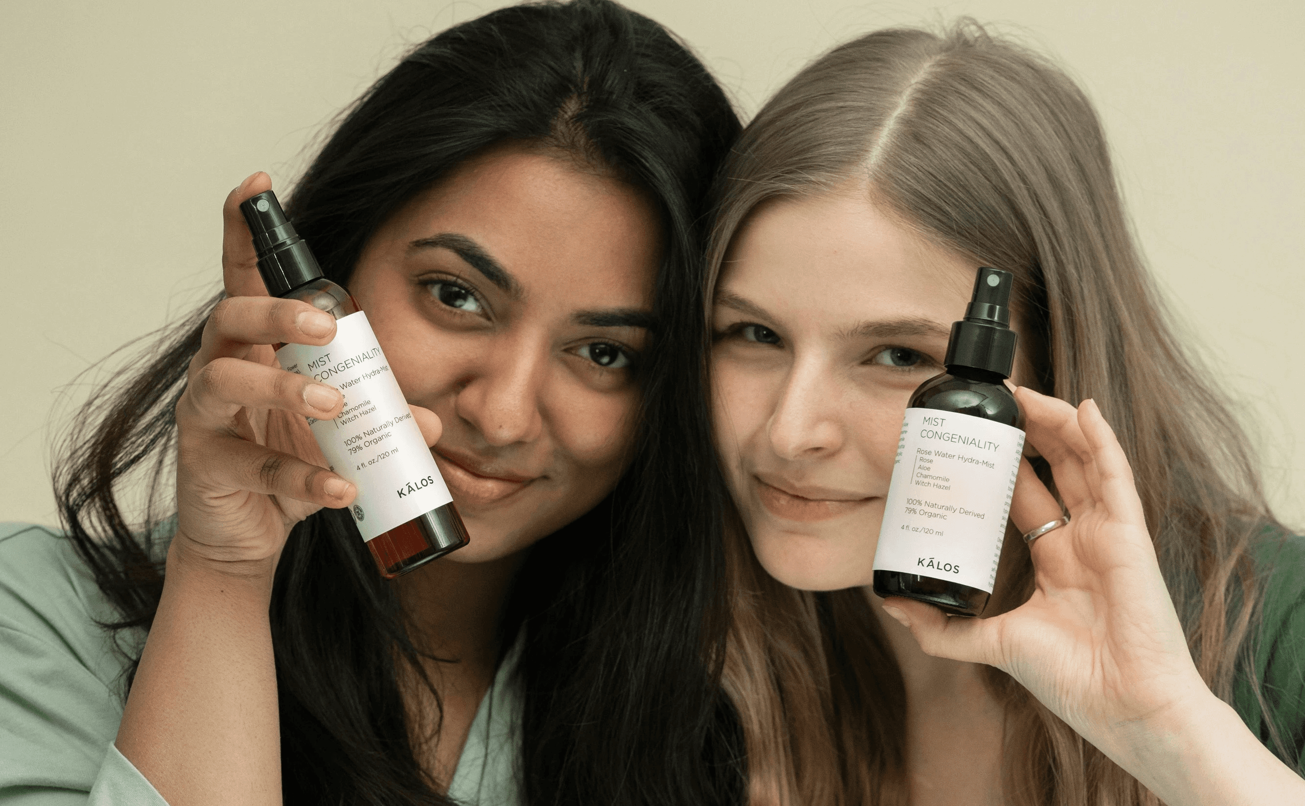 two women holding a skincare products