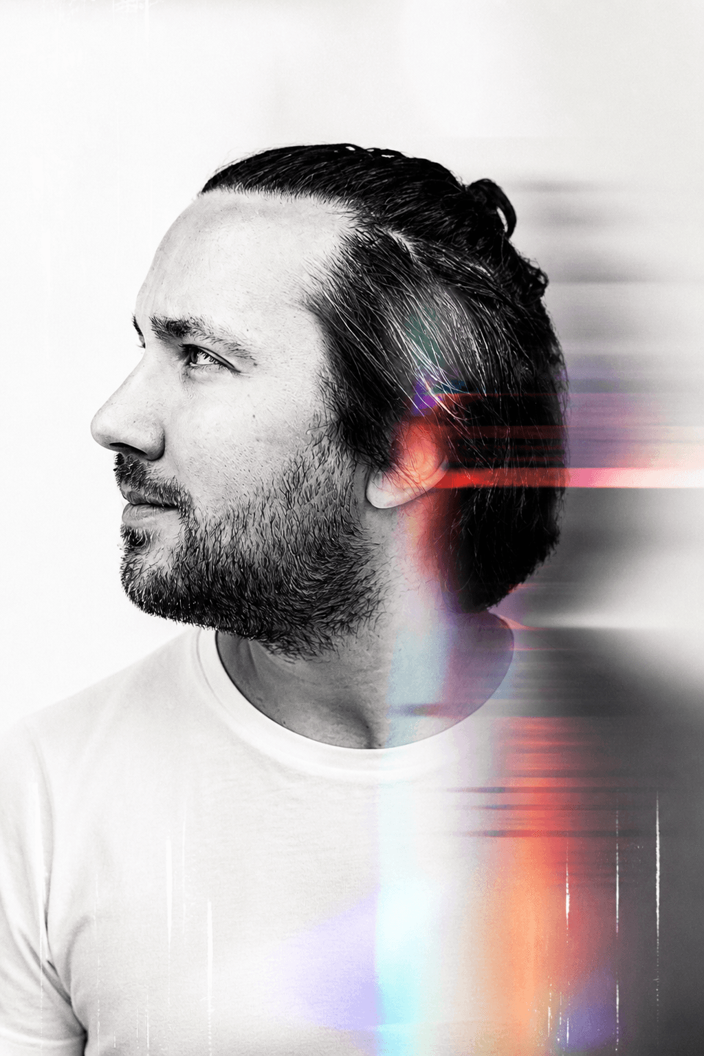 Portrait of a man with digital abstract effects and color overlays