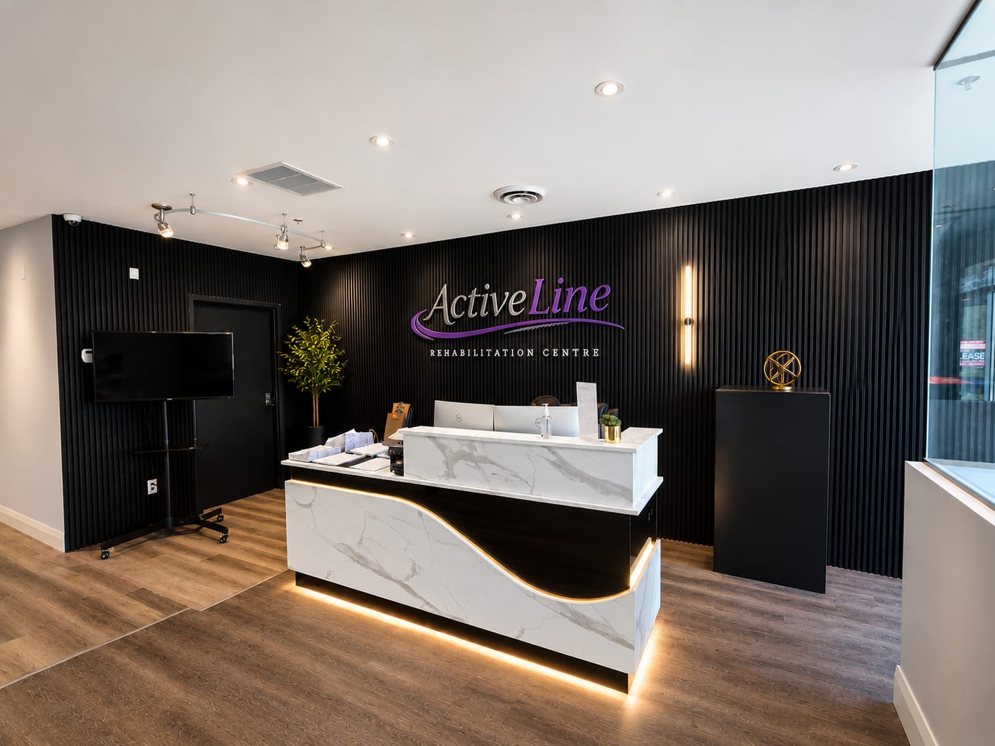 Modern reception desk with marble and wood accents.