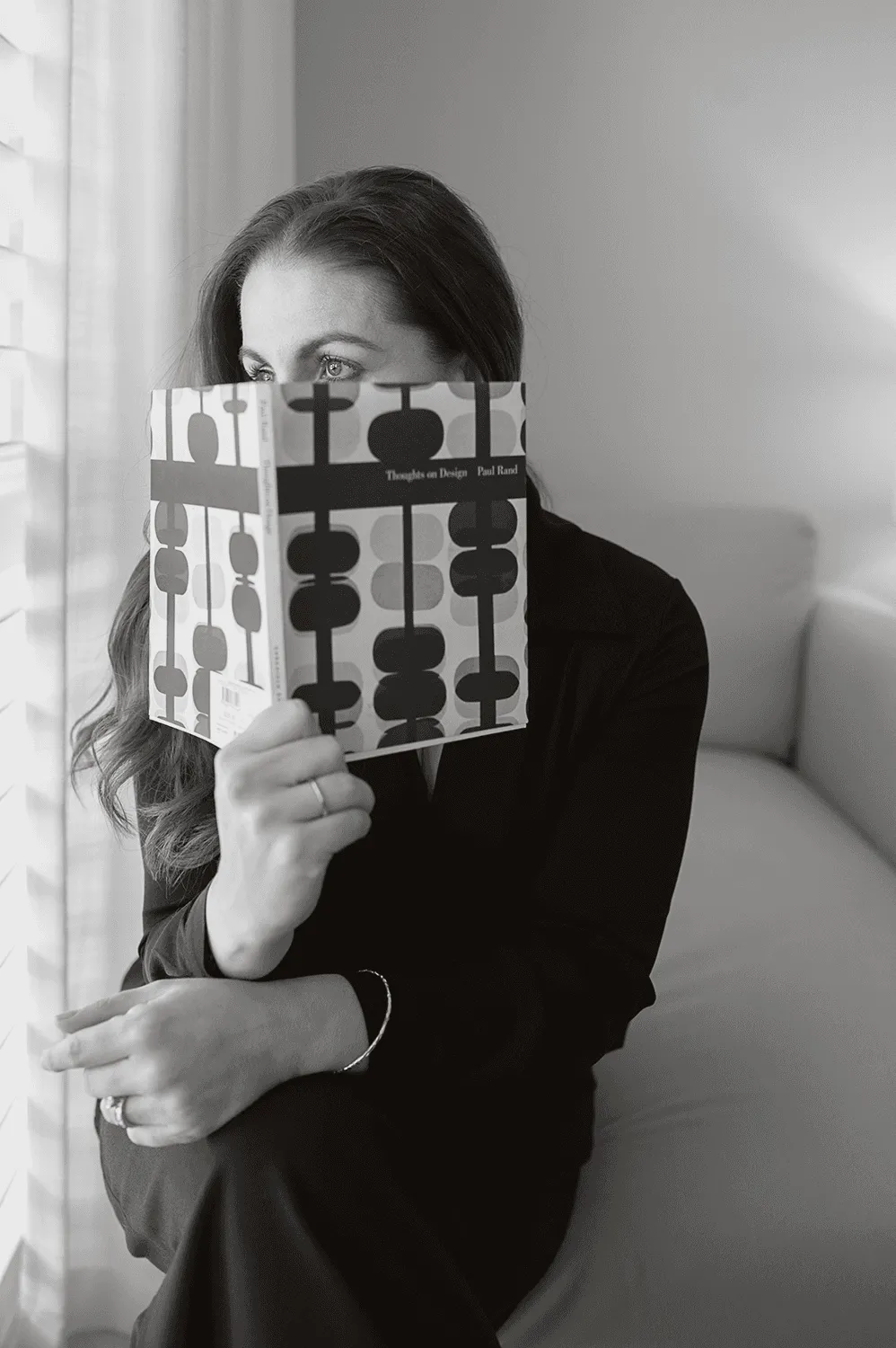 Natasha Brady, brand strategist and creative director, reading Paul Rand's Thoughts on Design, Telling Designs Perth Western Australia