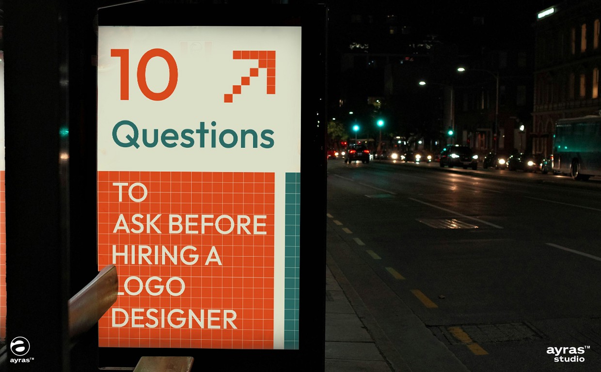 Entrepreneur interviewing a professional logo designer, asking key questions about process, portfolio, rights, and branding strategy