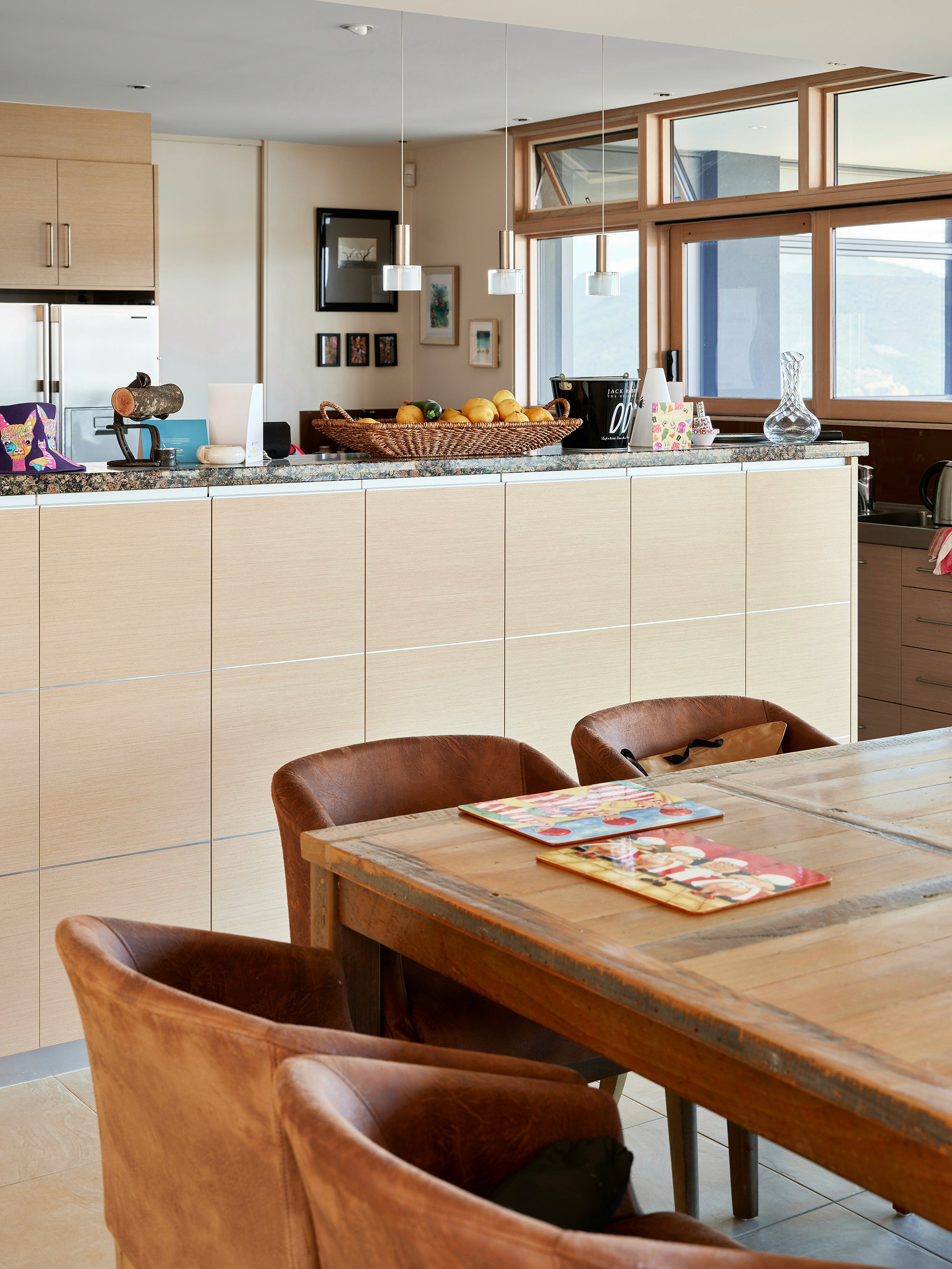 Modern hillside home with terracotta urn and mountain view