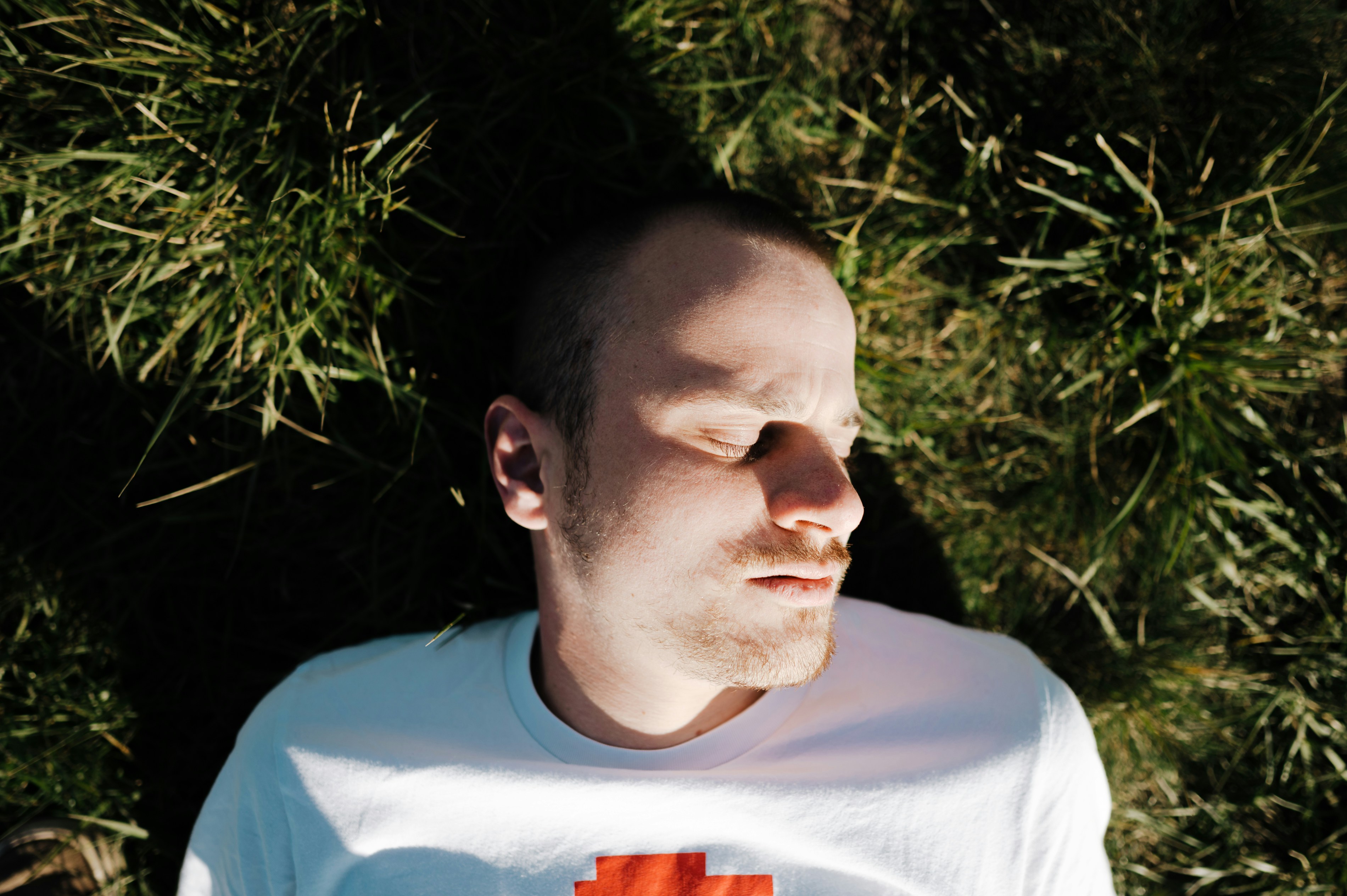 man taking a sunbath - Best Clothing Colors for Pale Skin Male