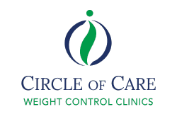 cars parked in front of green and white concrete building during daytime