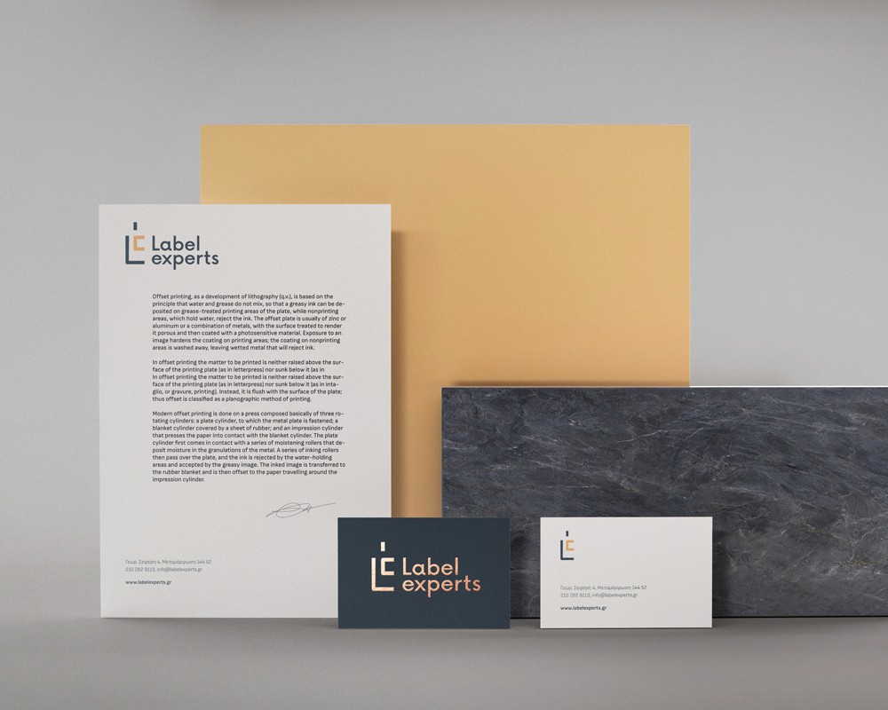Label Experts identity applied across letterhead and stationery with a clean composition