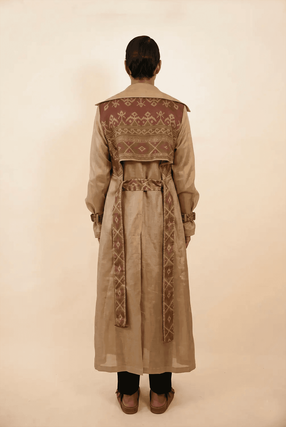Vedya is our one-of-a-kind off-white silk trench coat, handcrafted by skilled artisans in-house using a one-of-a-kind vintage silk saree.