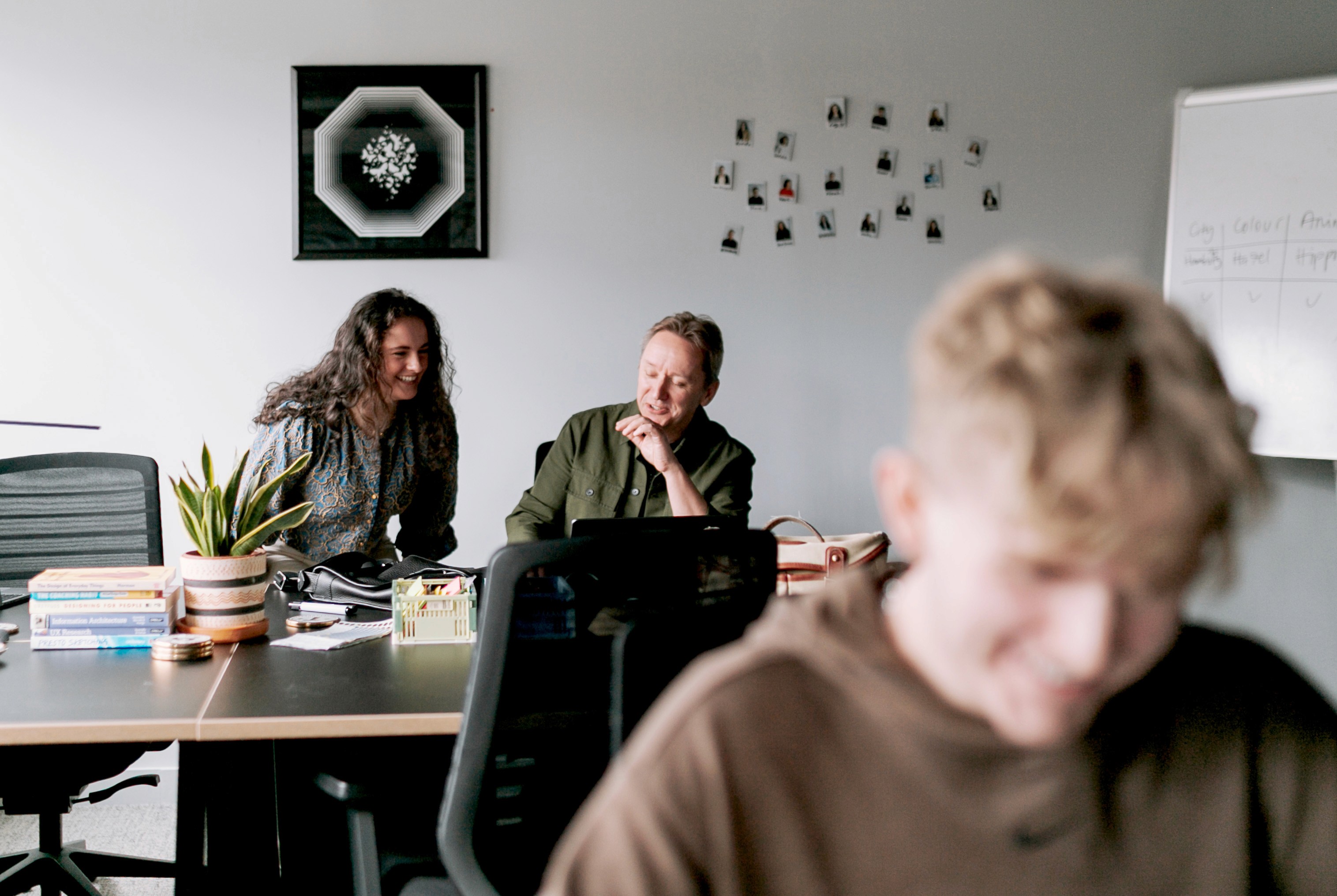 Two team members collaborating in office