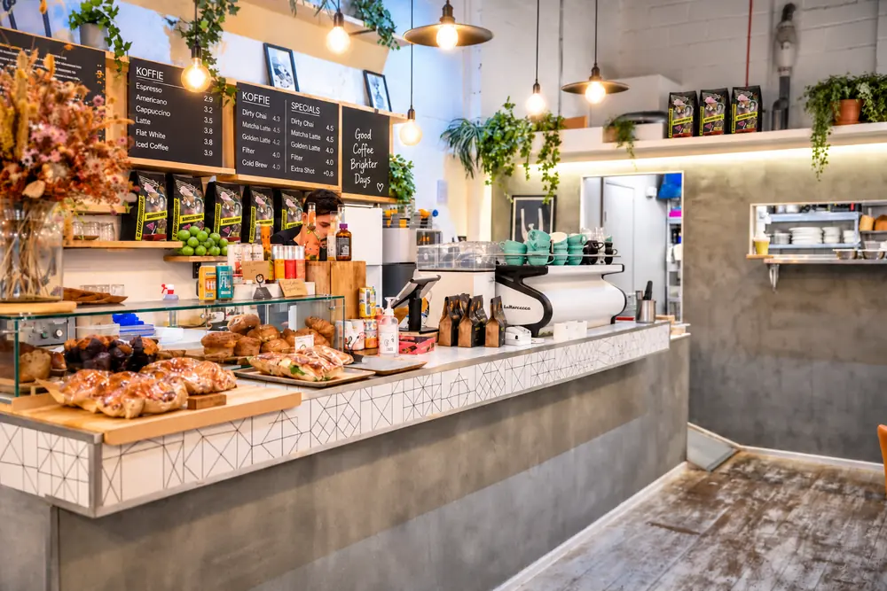 Baristocrats espresso bar counter with coffee products and machine
