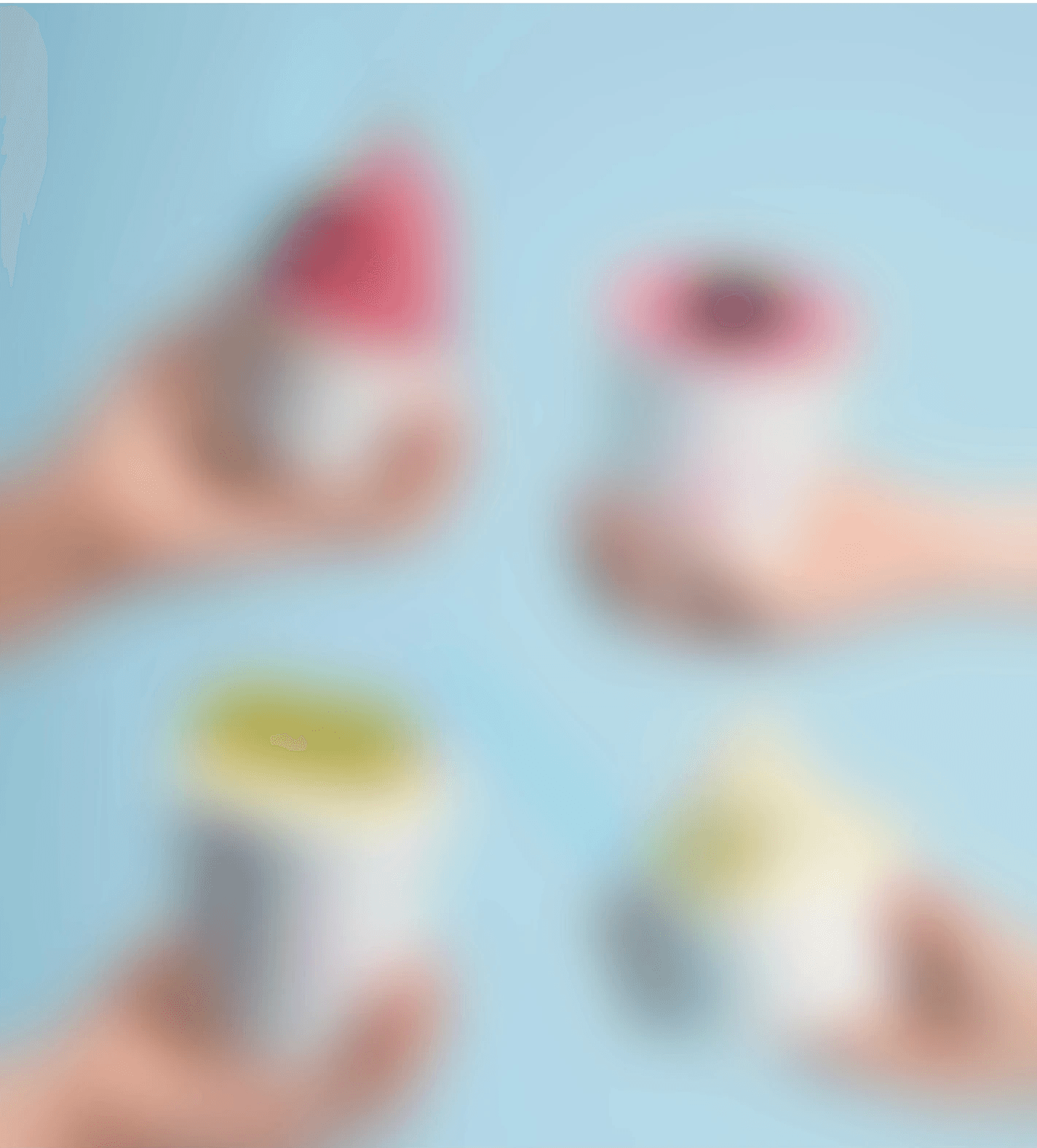 Person holding a green knitted handbag with a silver clasp, blurred green backdrop