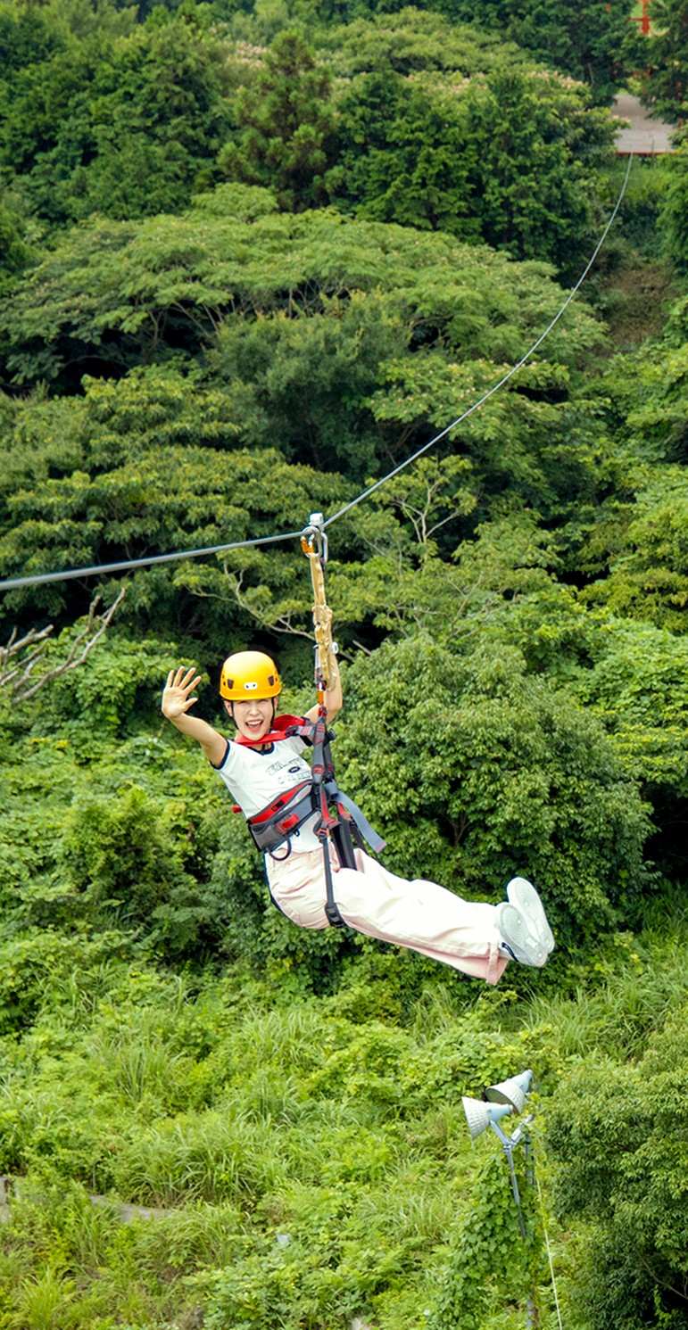 A futuristic female warrior in chrome armor holding a glowing blue sword