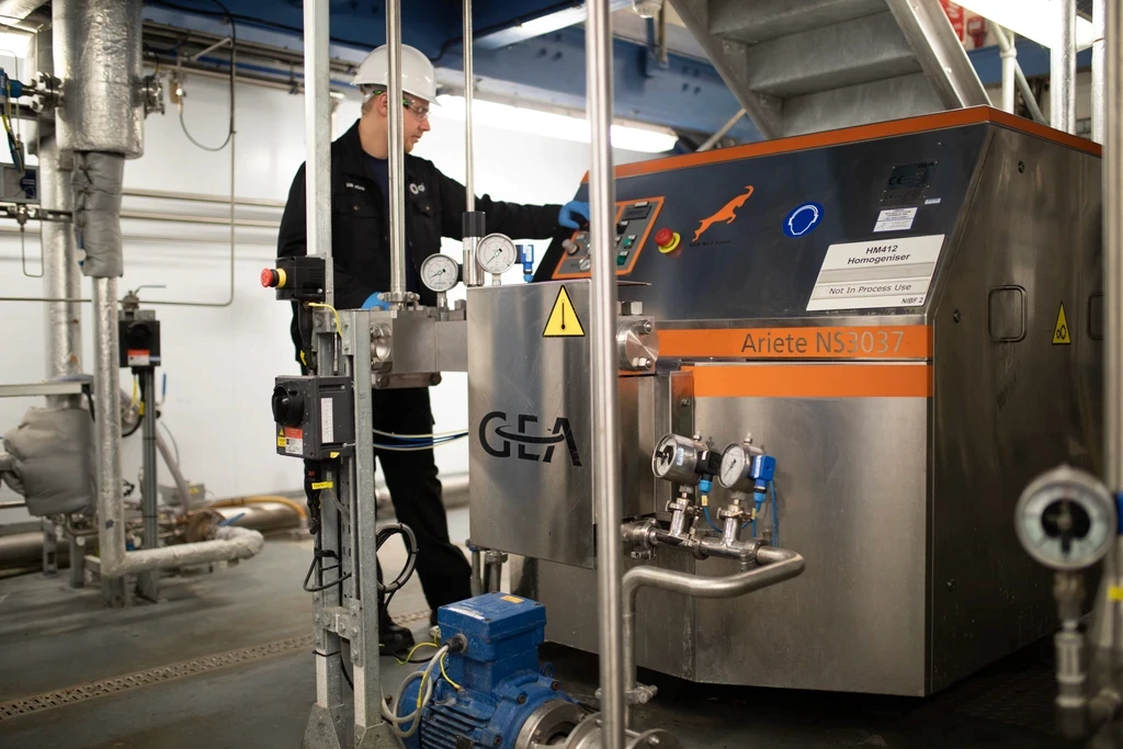CPI operator at a GEA Ariete industrial homogeniser in a process facility.