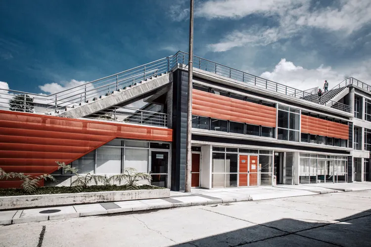 Vibrant purple and blue gradient paint splashing against a black background.