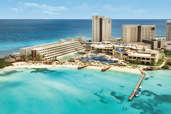 Hyatt Ziva Cancun resort and beach on a turquoise Caribbean bay, aerial view
