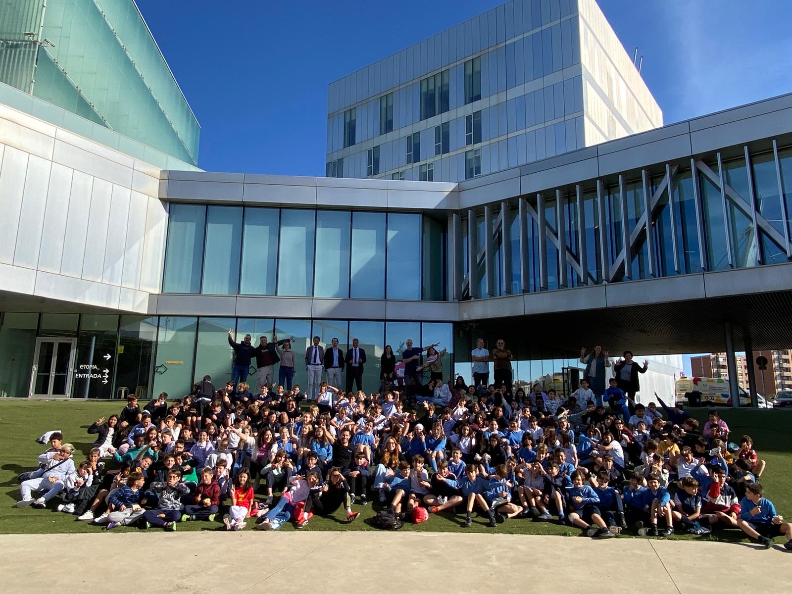 people sitting on chair in front of laptop computers