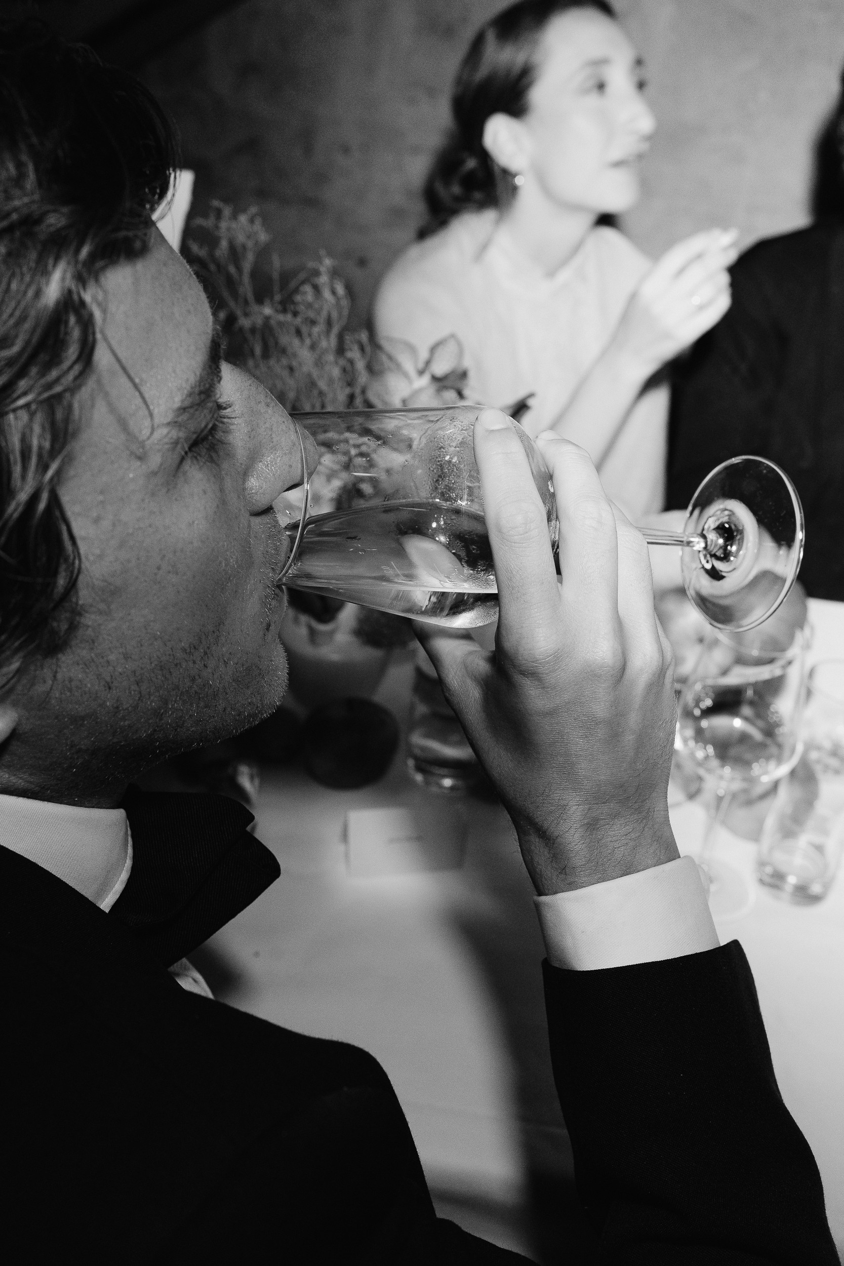 A serene outdoor scene featuring a stone structure adorned with colorful flowers cascading down the steps.