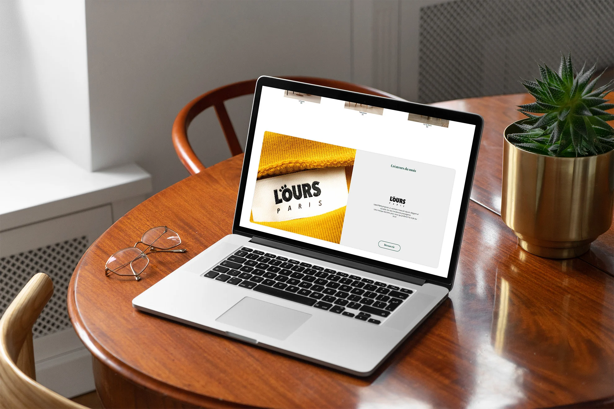 Mockup of the Little and Co page on a laptop