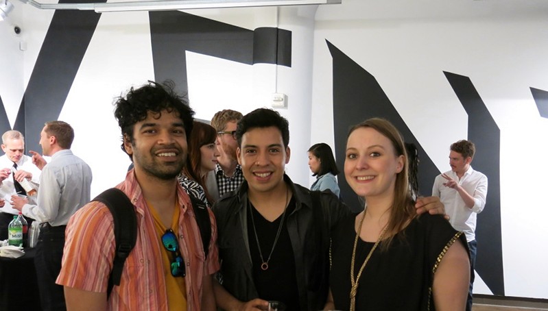 group portrait of two men and a woman on the right side