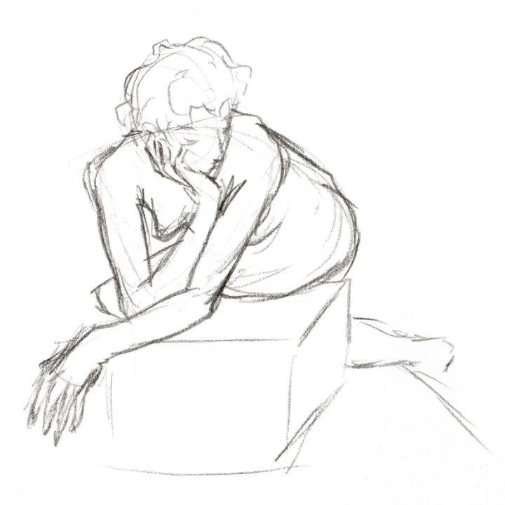 Life drawing of a woman lying on a box