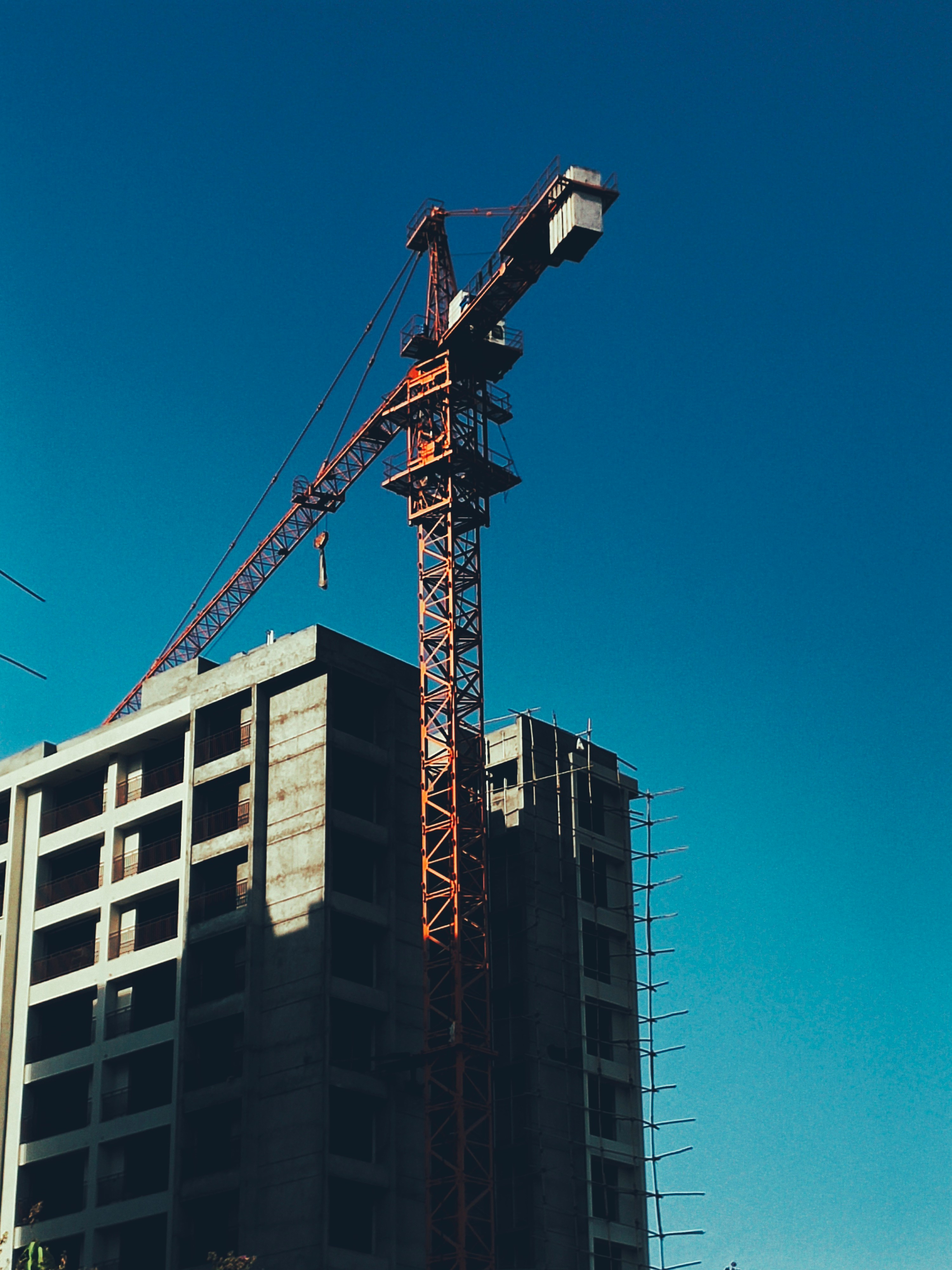 a crane on top of a building under construction