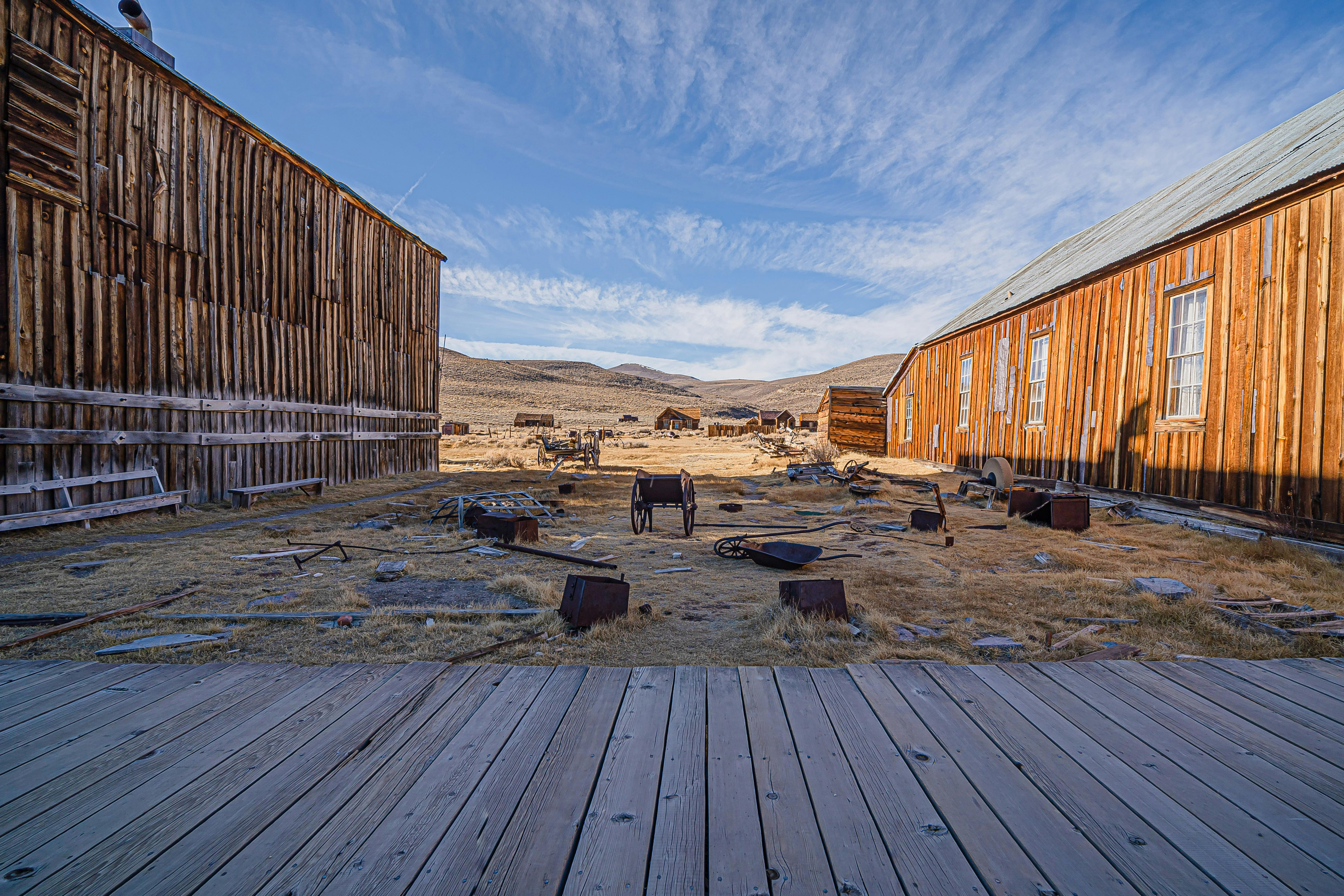 A glimpse into the past in Bodie, California's historic ghost town, showcasing its wooden buildings and desert landscape.