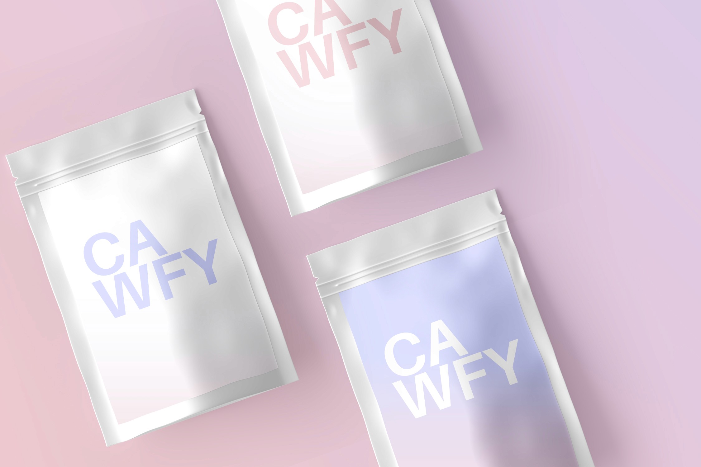 Packets of mockup coffee displayed at an angle to the image on a light pink background