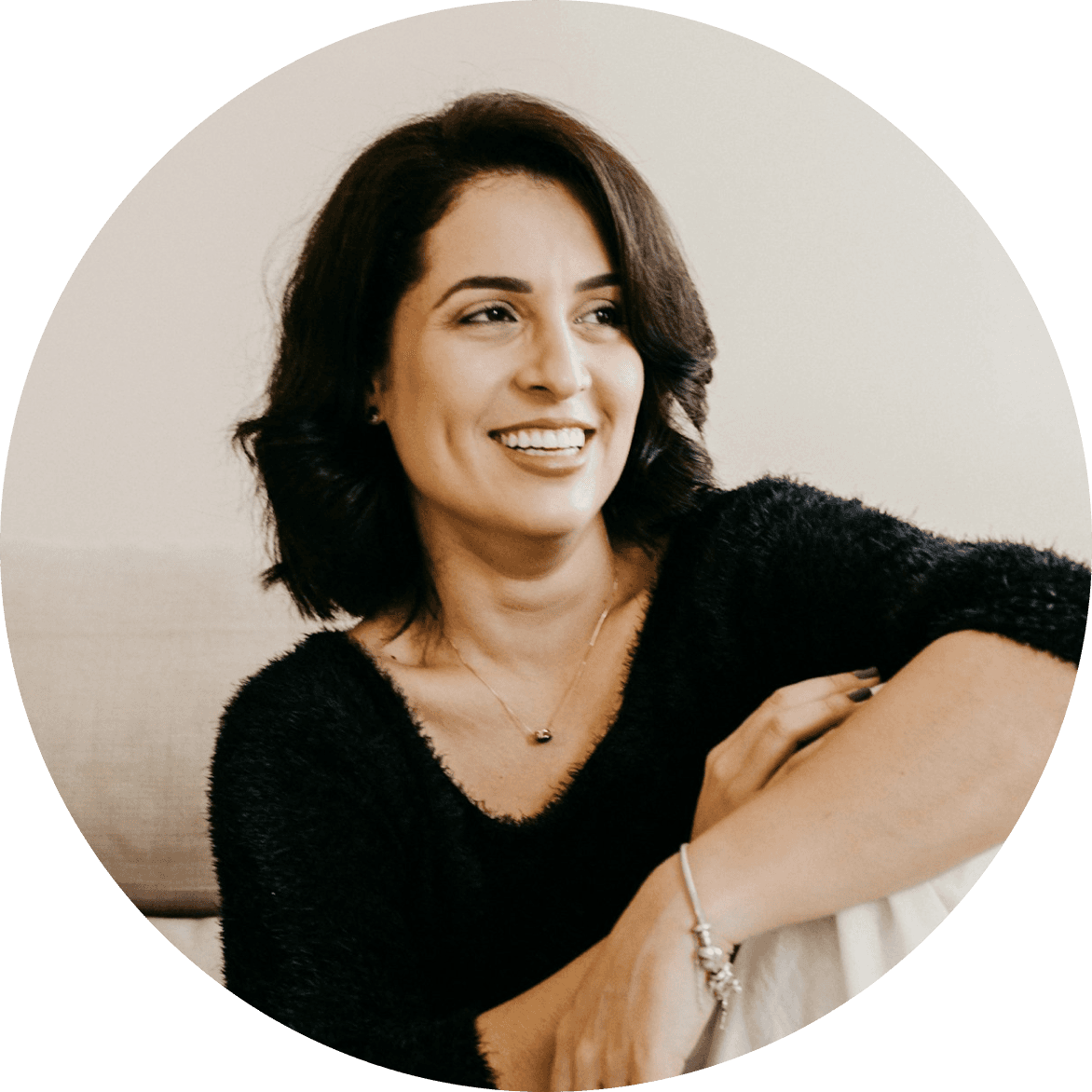 Woman smiling holding her head