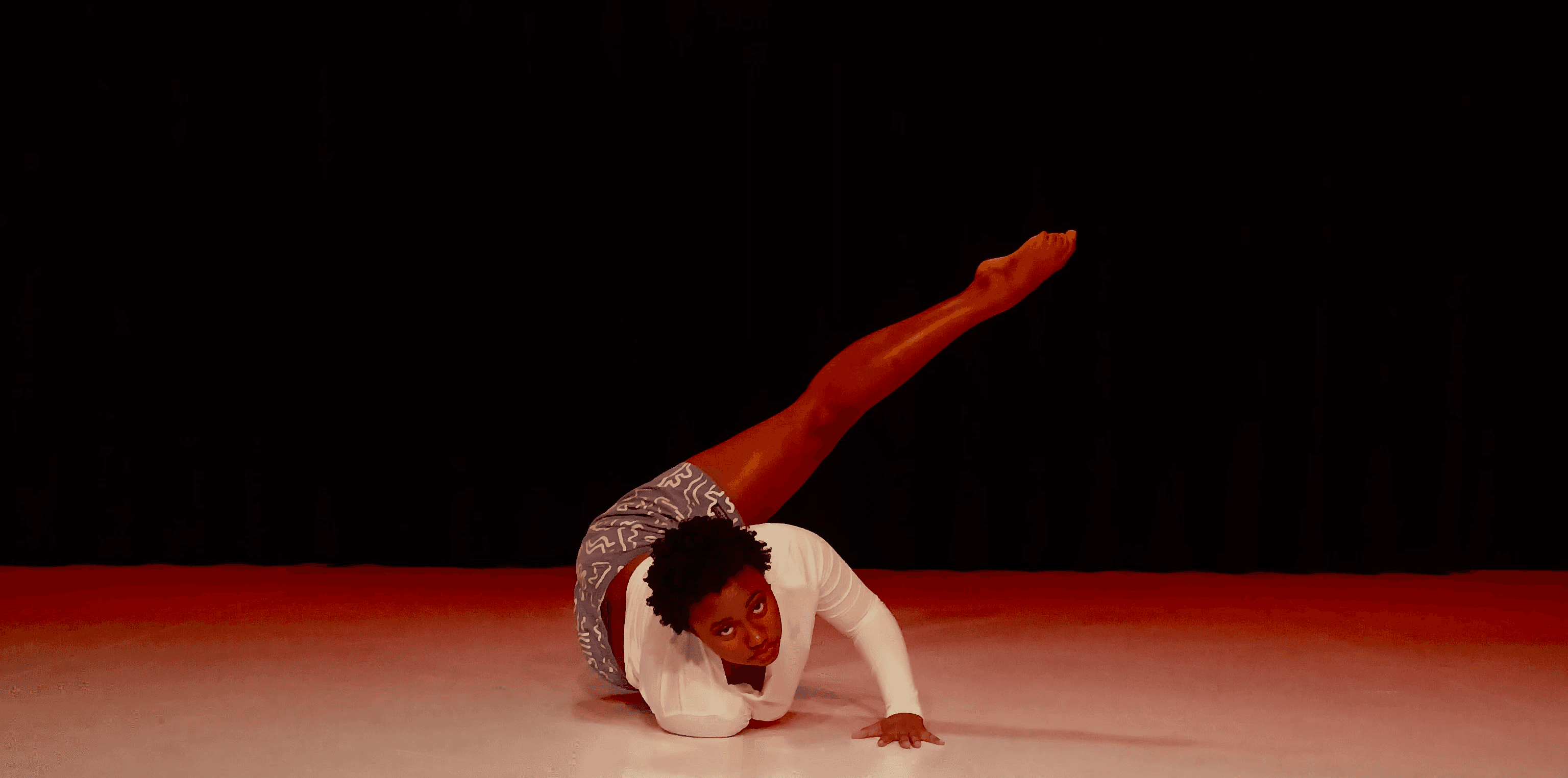 kids lying on a glass land and smiling